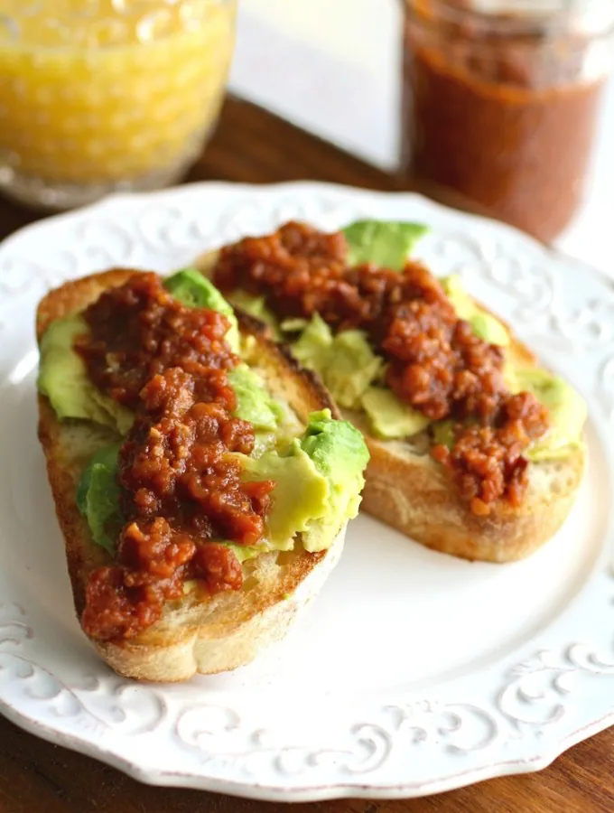 Tomato-Bacon Jam with Avocado Toast is a simple, yet indulgent dish perfect for breakfast