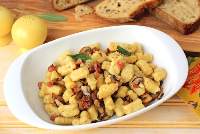 A serving bowl of Homemade Gnocchi with Pancetta, Mushrooms, and Sage is a delight