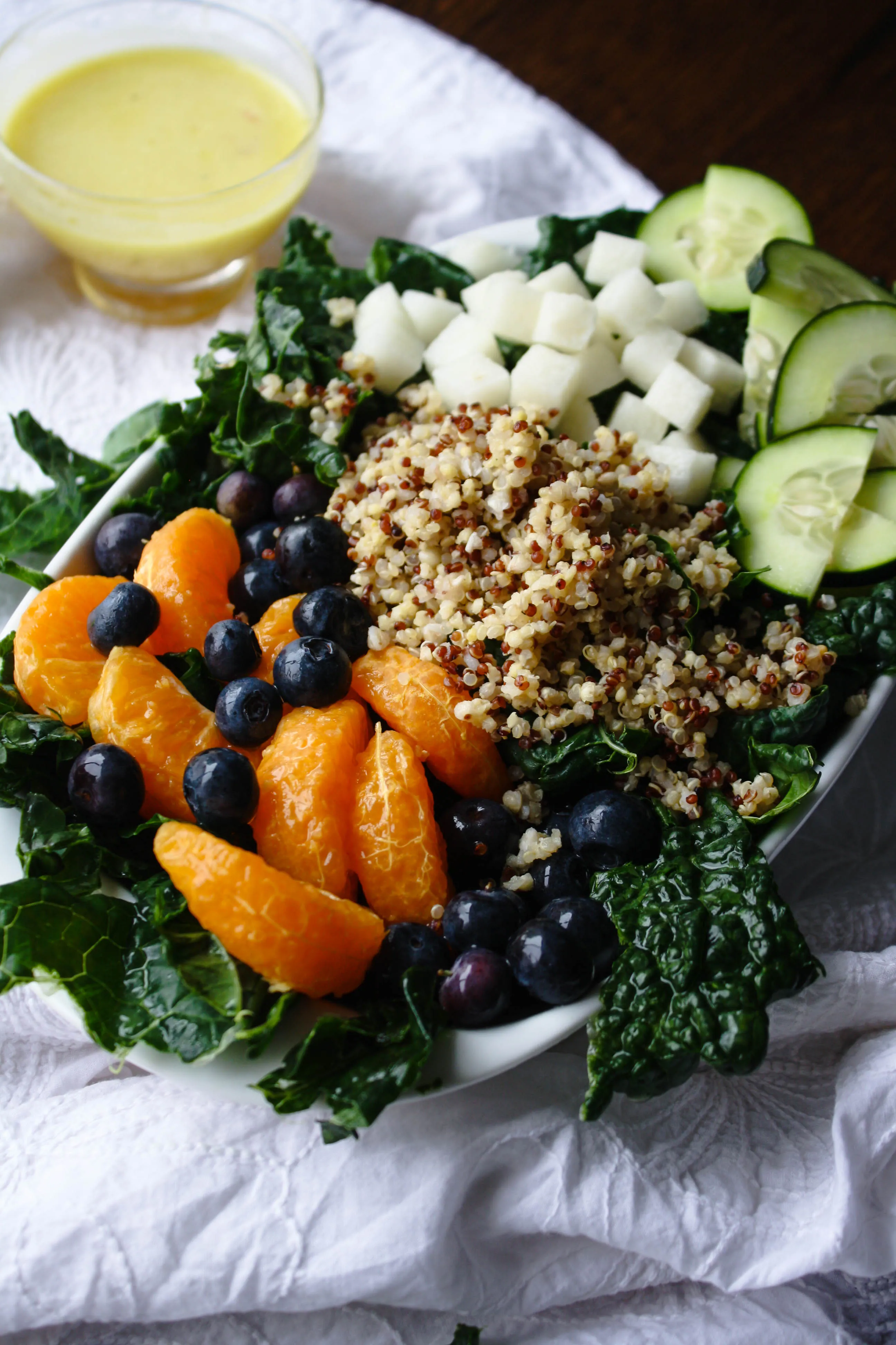 Kale-Quinoa Salad with Orange Vinaigrette is a super-hearty salad. It's easy to make, and has loads of good ingredients!