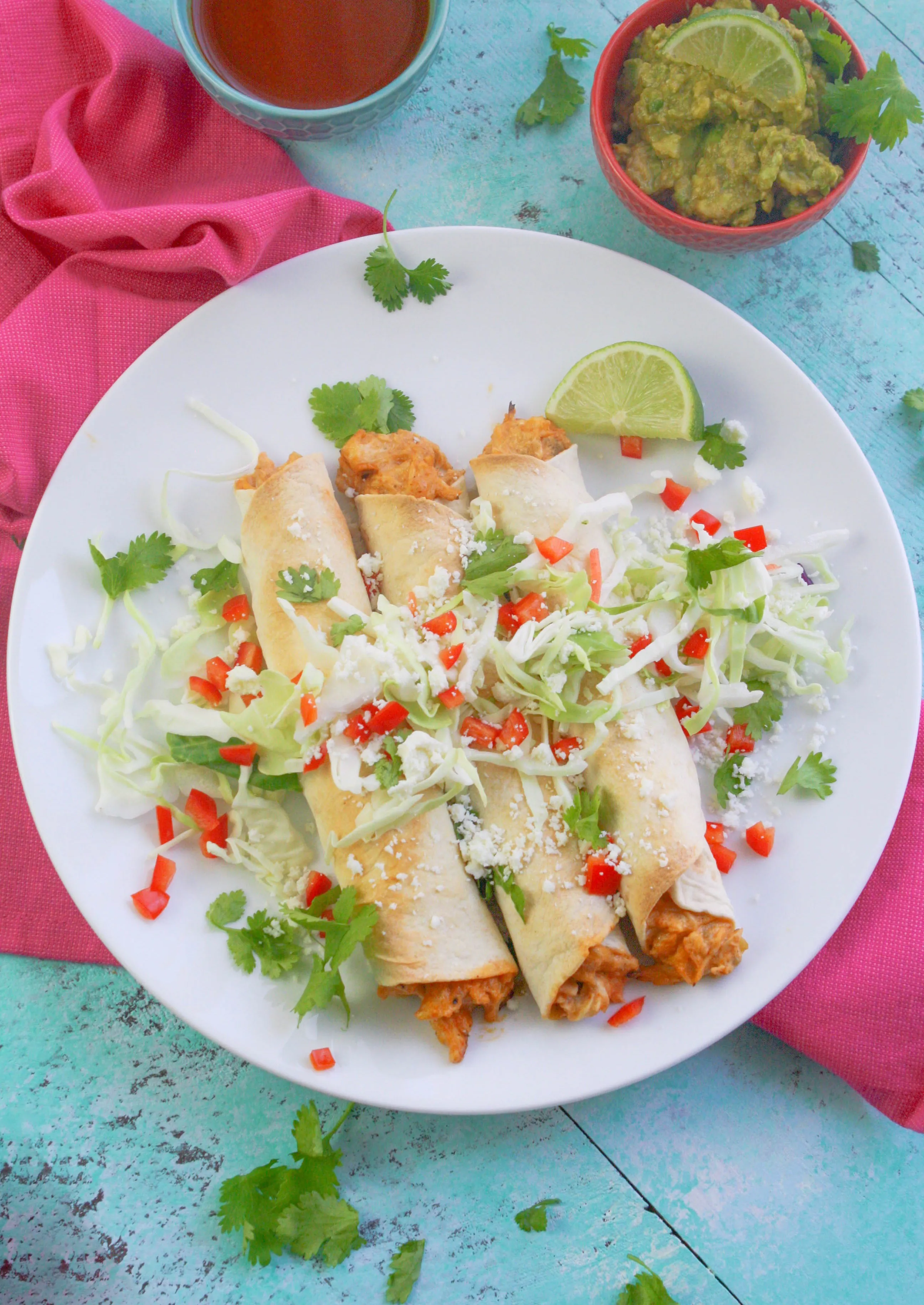 Baked Chicken and Green Chile Taquitos are easy to make for a favorite snack. Baked Chicken and Green Chile Taquitos are a Mexican-inspired favorite dish!