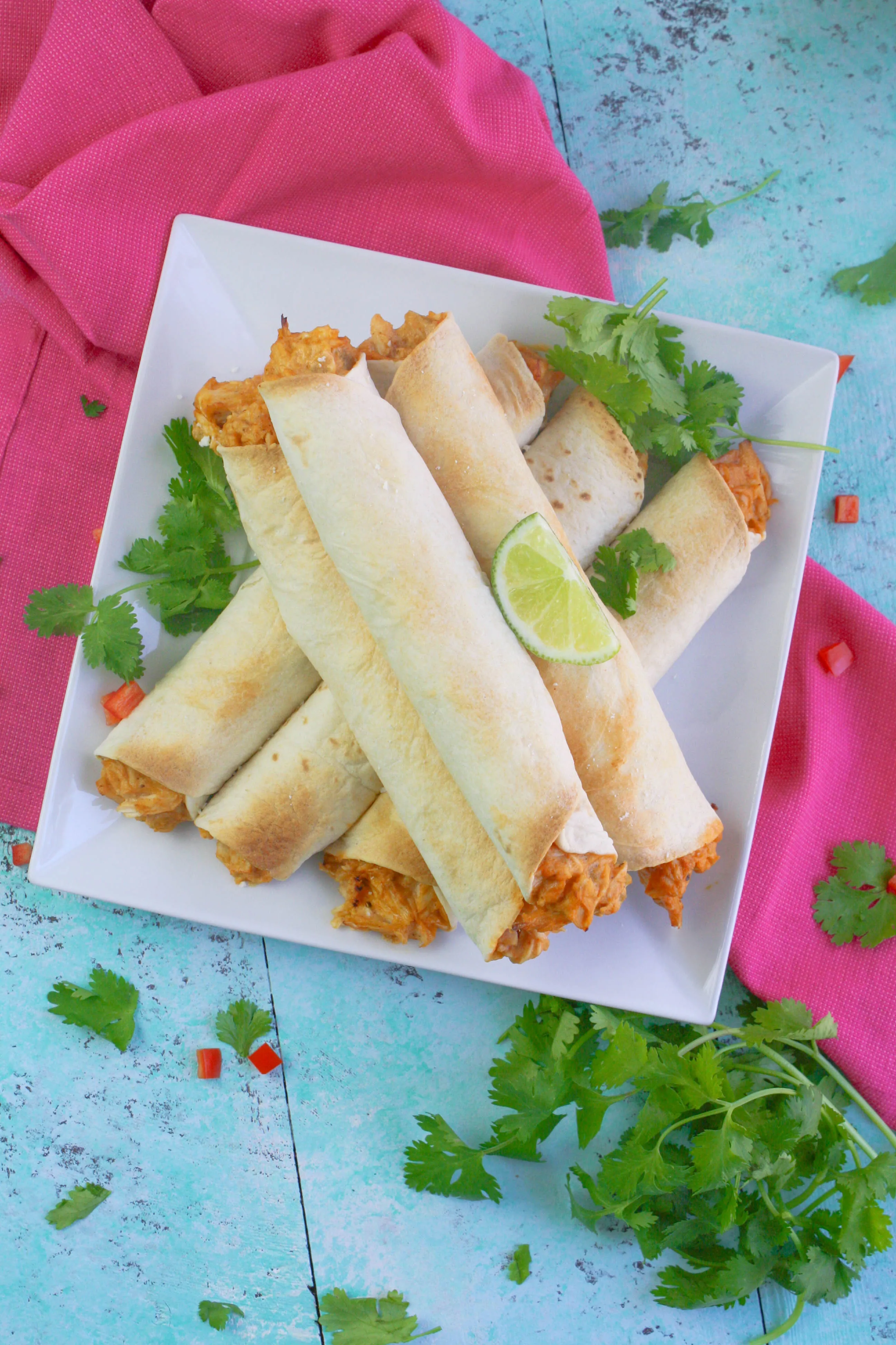 Baked Chicken and Green Chile Taquitos are a treat you will enjoy for a snack or meal. Baked Chicken and Green Chile Taquitos are fun to serve with all sorts of toppings!