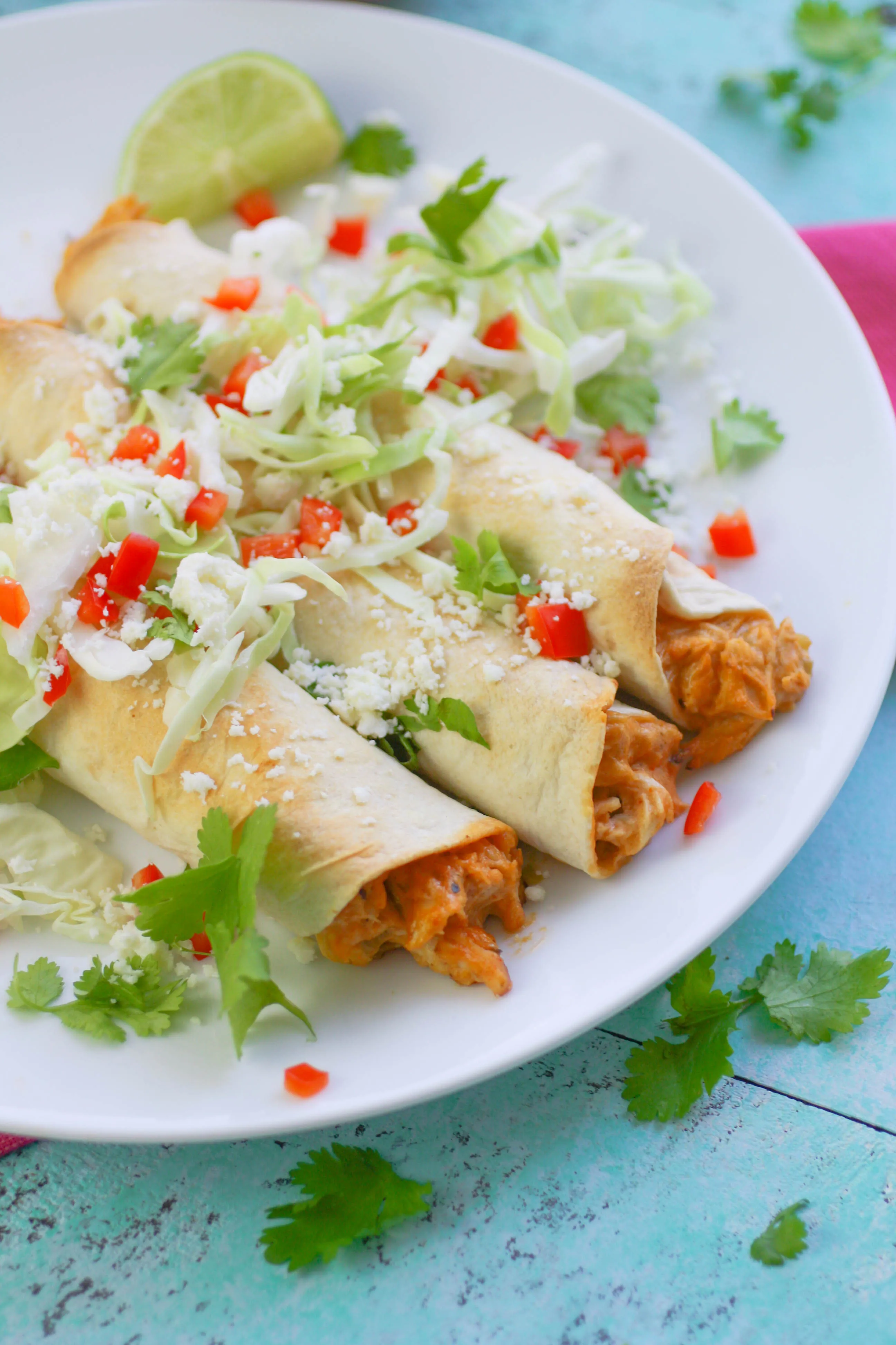 Baked Chicken and Green Chile Taquitos are filling and easy to make as a snack or part of a light meal. Baked Chicken and Green Chile Taquitos are a Mexican-inspired favorite to serve anytime! 