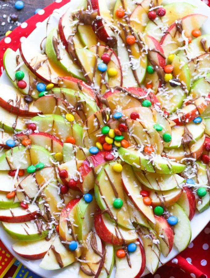 Apple nachos with chocolate & caramel drizzle are festive and fun any day of the week!