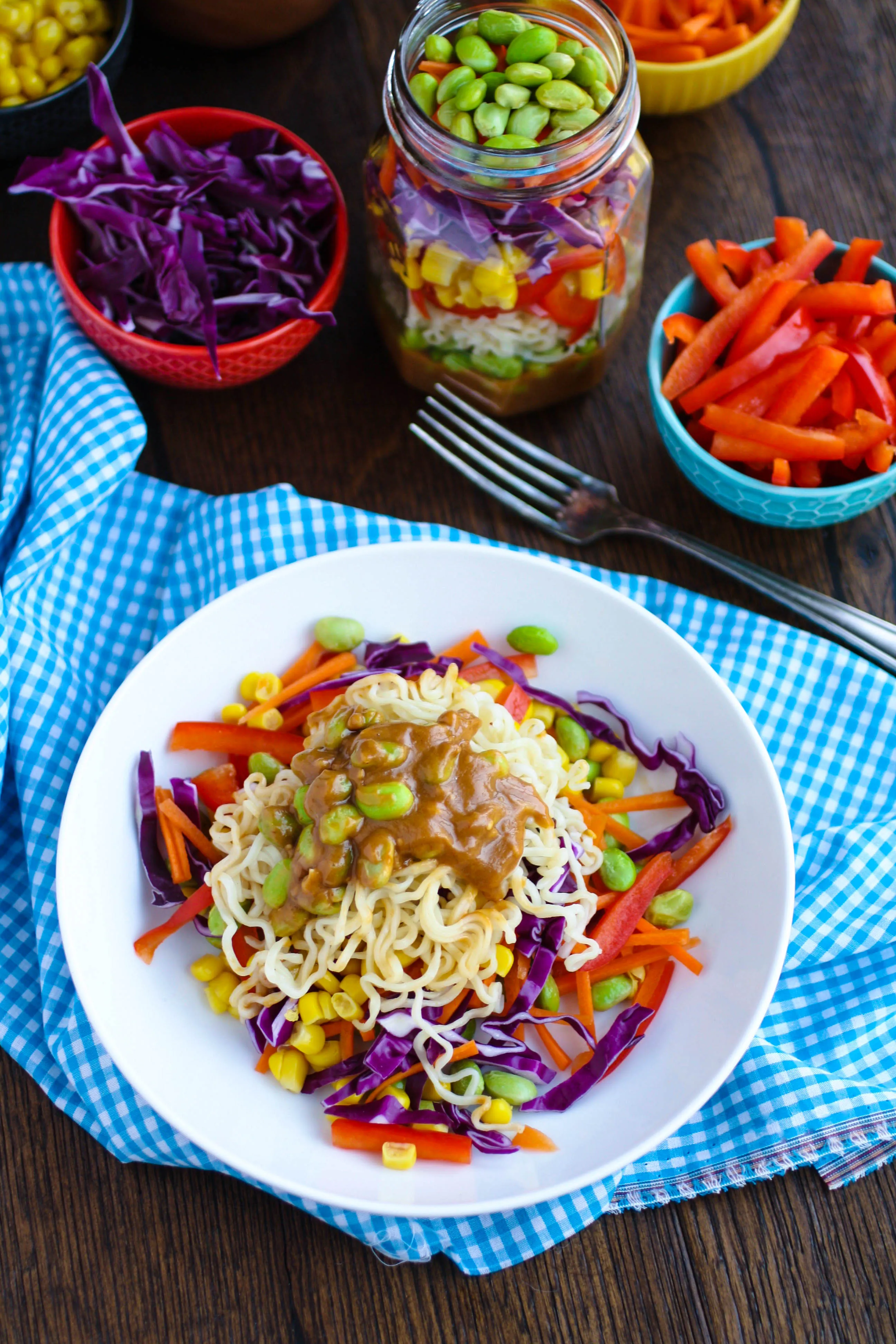 Asian Noodle Salad in a Jar with Spicy Peanut Dressing is a convenient way to pack a salad. You'll love the colors, the crunch, and the delicious dressing.