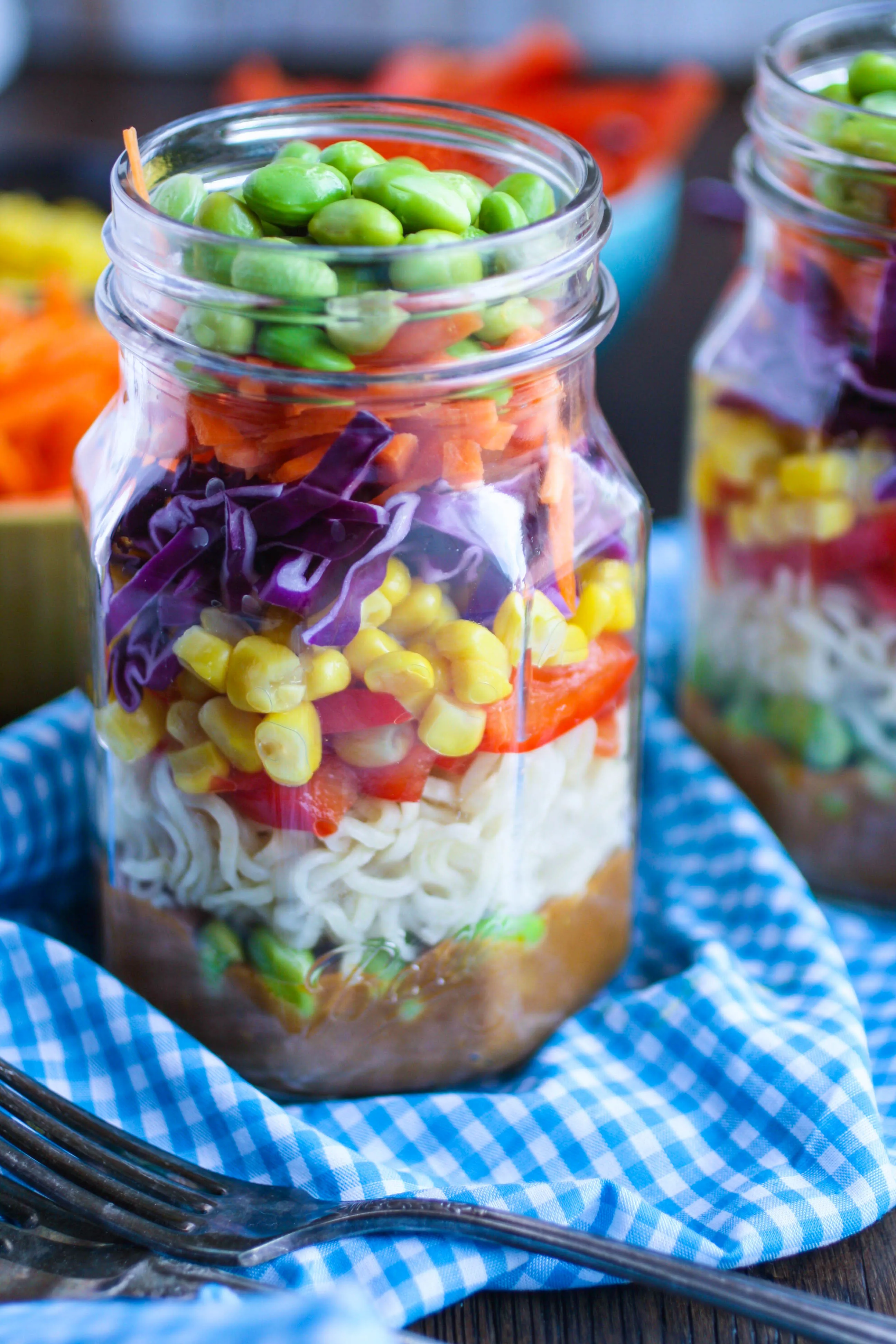 Asian Noodle Salad in a Jar with Spicy Peanut Dressing offers great color and flavors. It's convenient to pack, and delicious to eat!