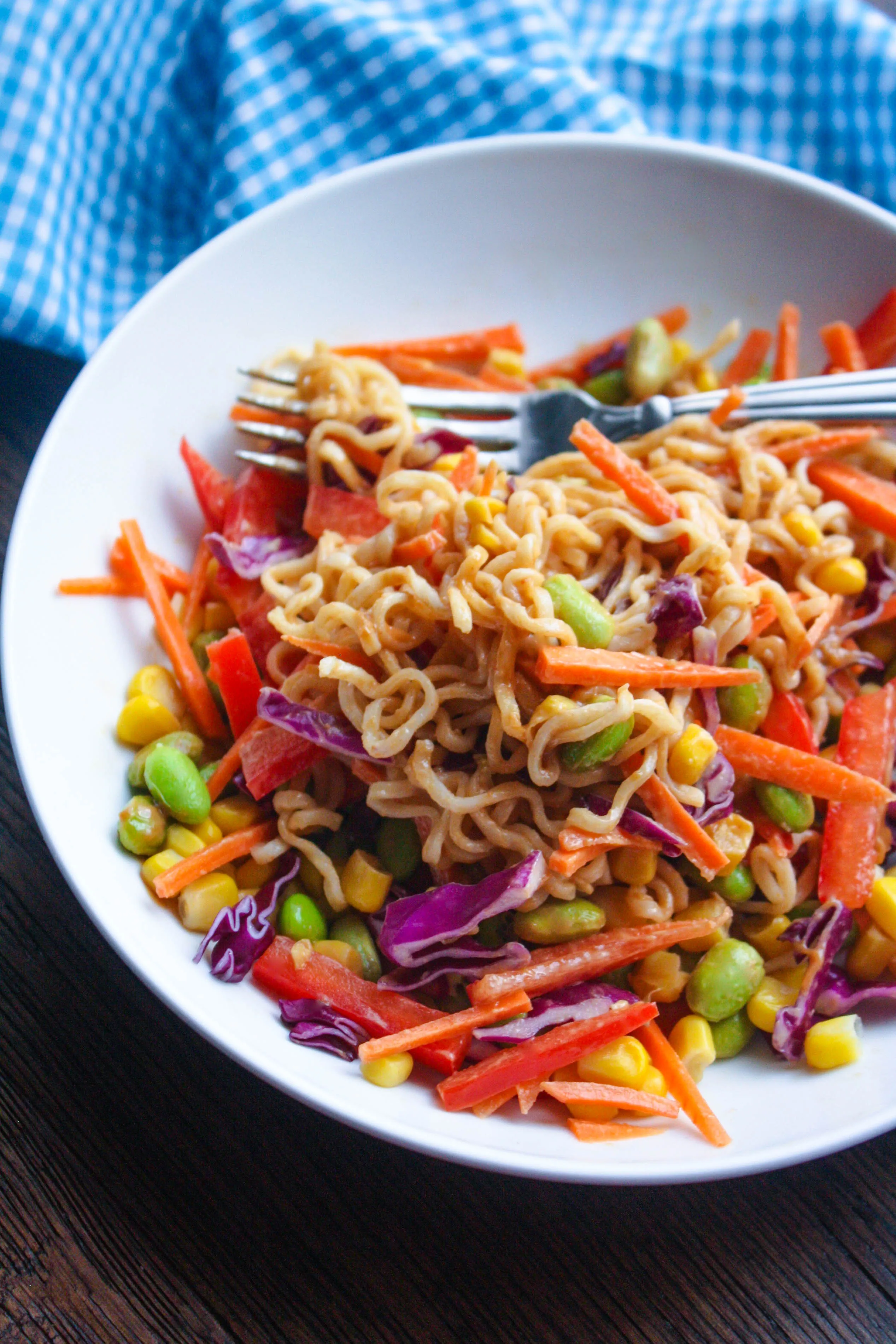 Asian Noodle Salad in a Jar with Spicy Peanut Dressing is a salad you'll reach for again and again. It's filled with great veggies and crunch, and a delicious dressing!