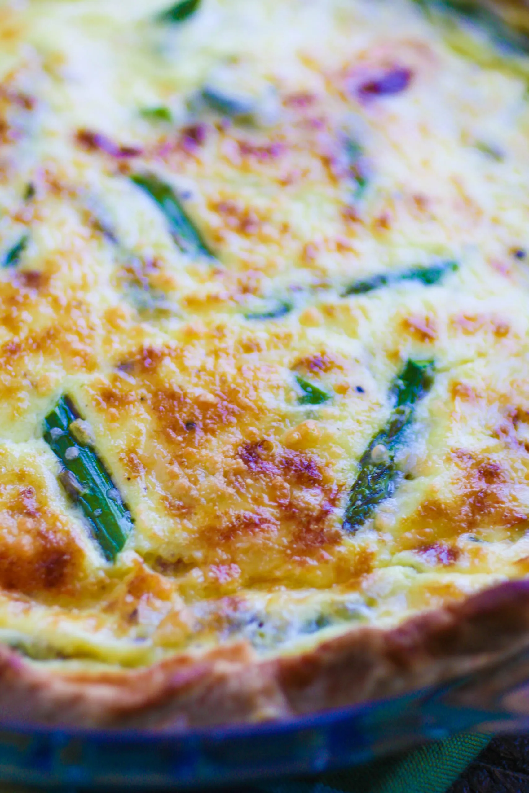 Asparagus and Pancetta Quiche is golden on top thanks to the rich Swiss cheese added to the mix.