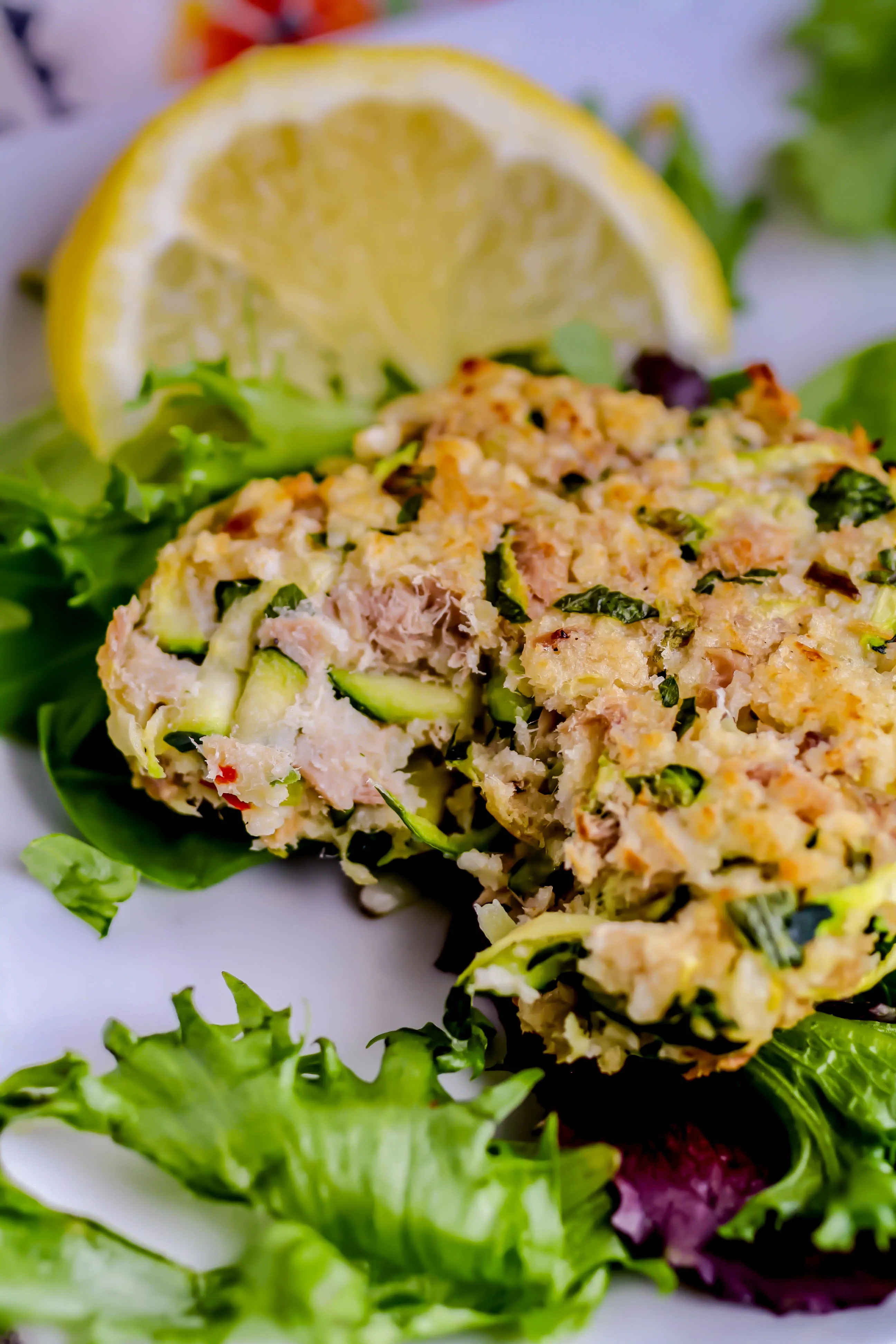 Baked Tuna and Zucchini Cakes with Lemon-Yogurt Dressing are healthy and fresh for a great treat! Baked Tuna and Zucchini Cakes with Lemon-Yogurt Dressing are baked, not fried, for a healthier snack or light meal.
