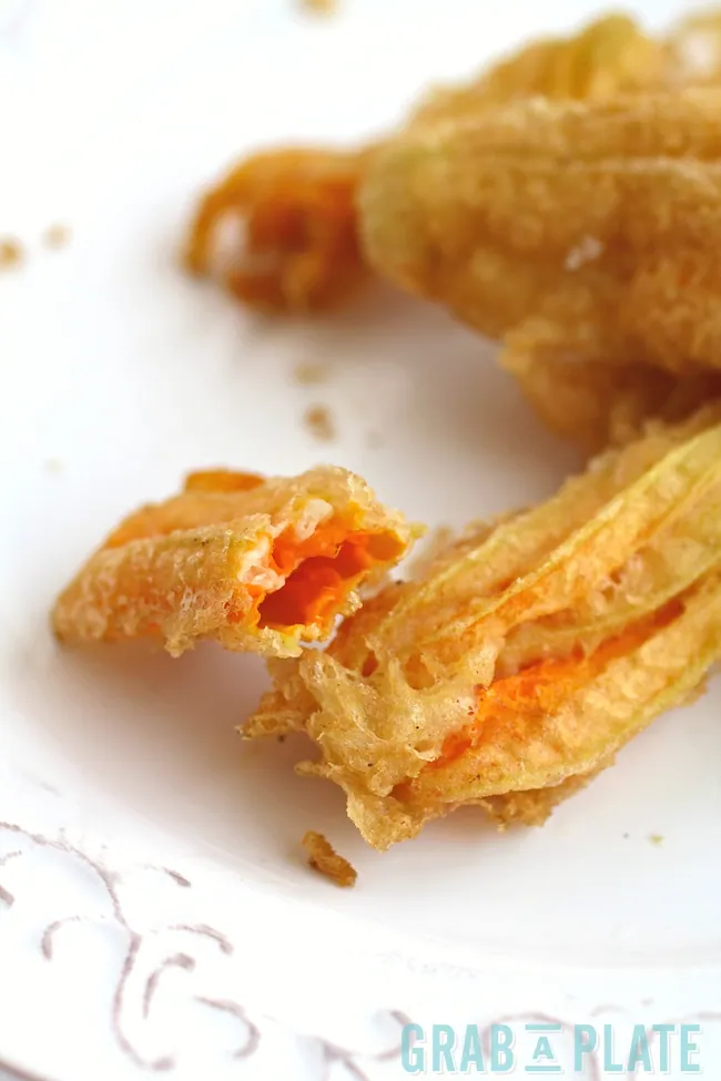 Just one bite of Fried Zucchini Blossoms is all it takes to fall in love with this appetizer