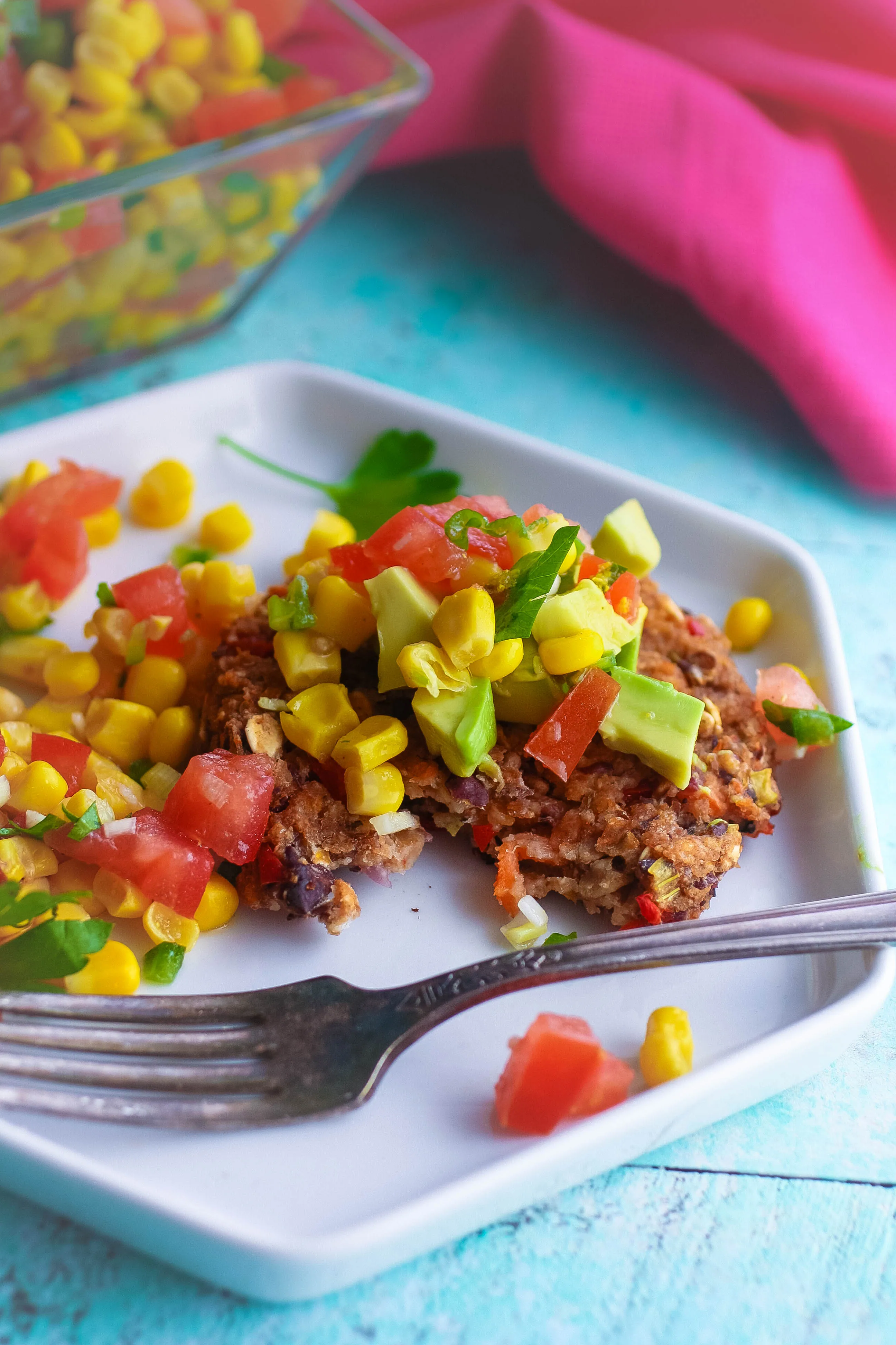 Black Bean Veggie Burgers with Corn Salsa don't include eggs or dairy, and make a perfect meatless meal! You'll love the flavors in these Black Bean Veggie Burgers with Corn Salsa!