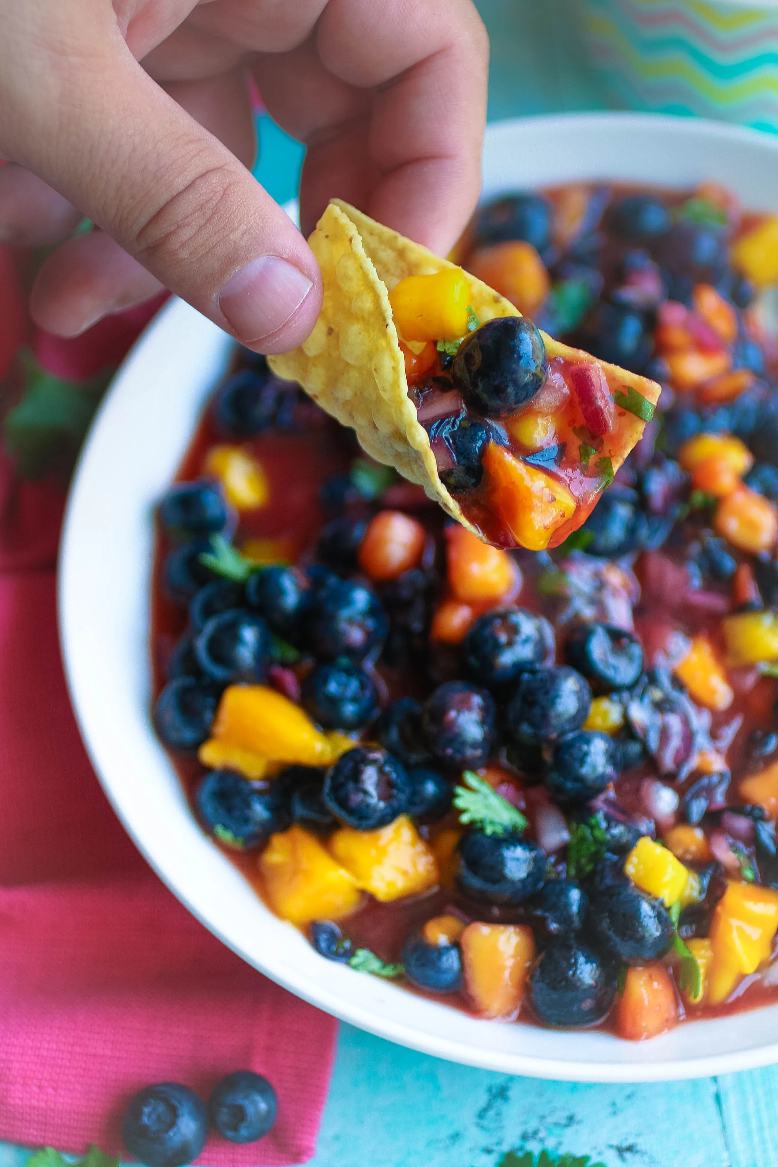 You'll want to dig in to this Blueberry-Mango Salsa. Blueberry-Mango Salsa is a delightful snack for the summer!