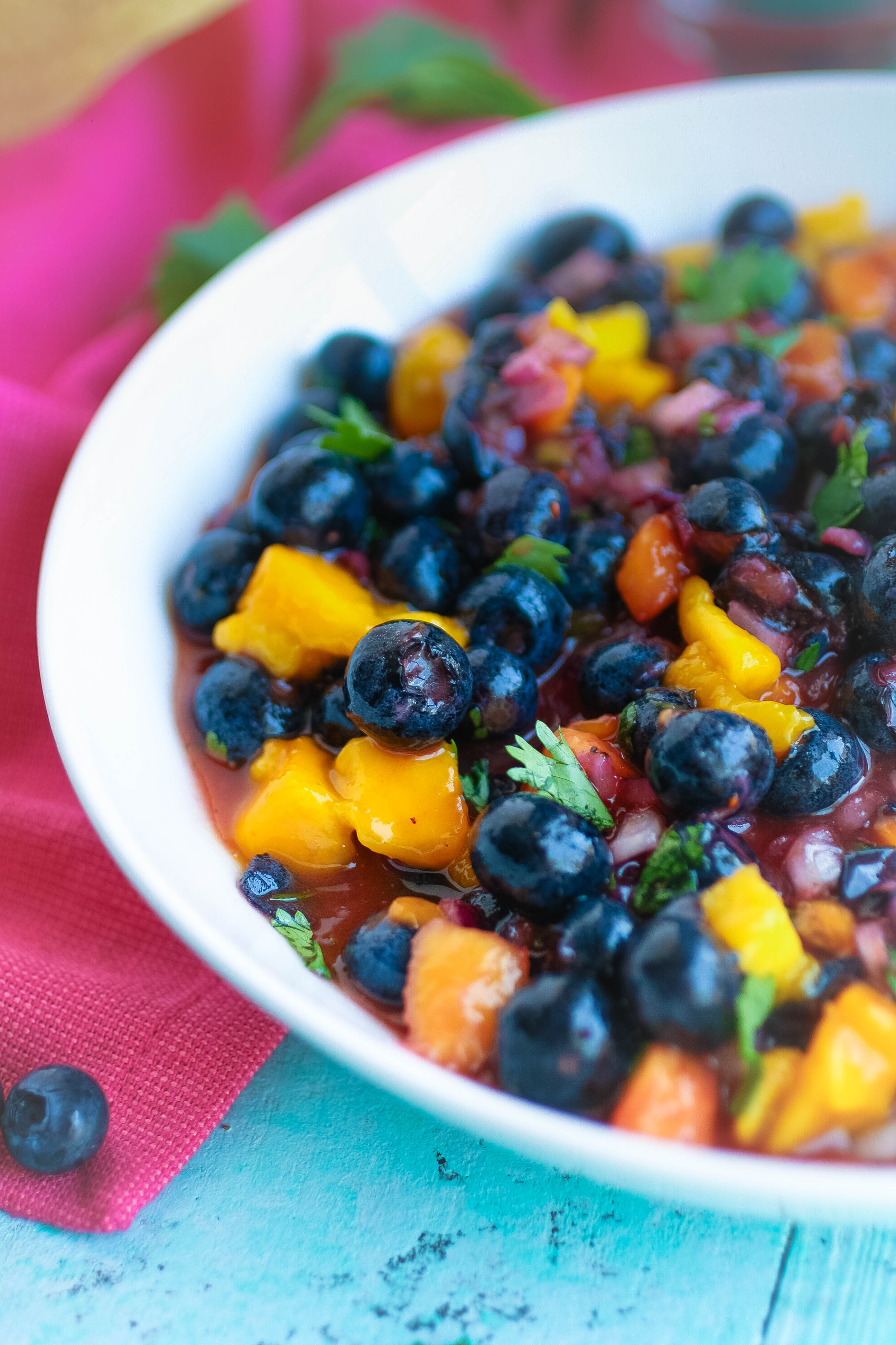 Blueberry-Mango Salsa is a snack you'll want to dig into over and over again this season! Blueberry-Mango Salsa is a tasty and easy snack for the season.