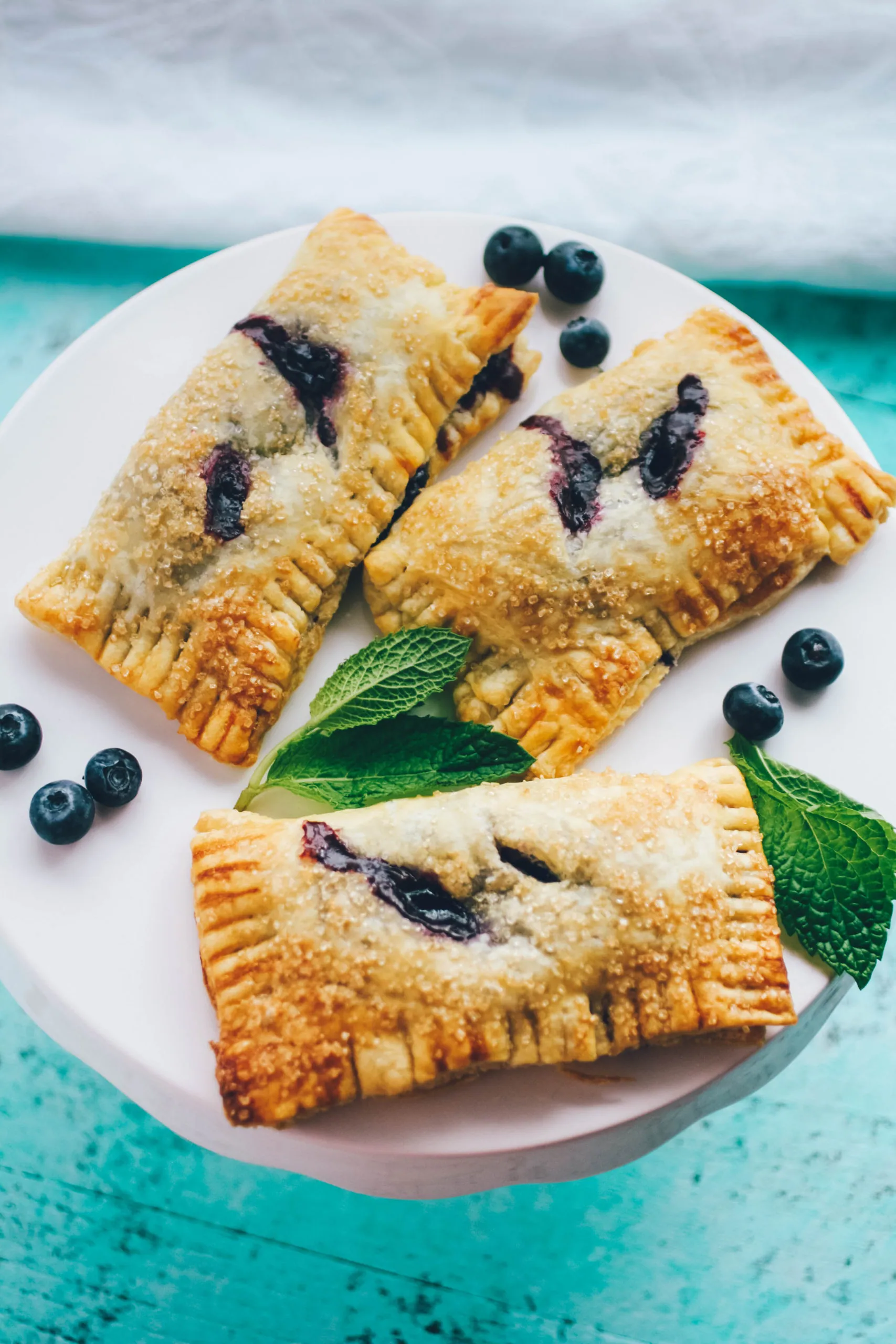 Blueberry Mint Hand Pies are wonderful for a summer dessert! You'll love these Blueberry Mint Hand Pies.