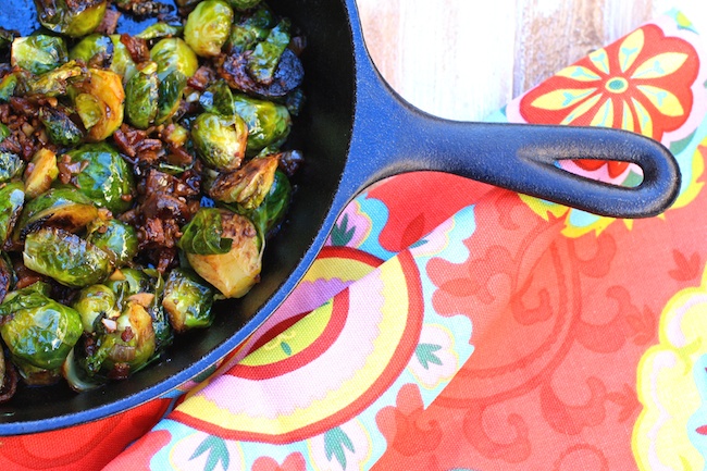 Roasted Brussels Sprouts with Chipotle-Bacon Jam in a skillet