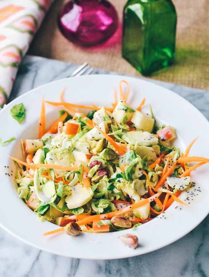 Brussels Sprouts Salad with Carrots, Apples, Pistachios & Poppy Seed Dressing is a hearty, winter salad. You'll enjoy this Brussels Sprouts Salad with Carrots, Apples, Pistachios & Poppy Seed Dressing.