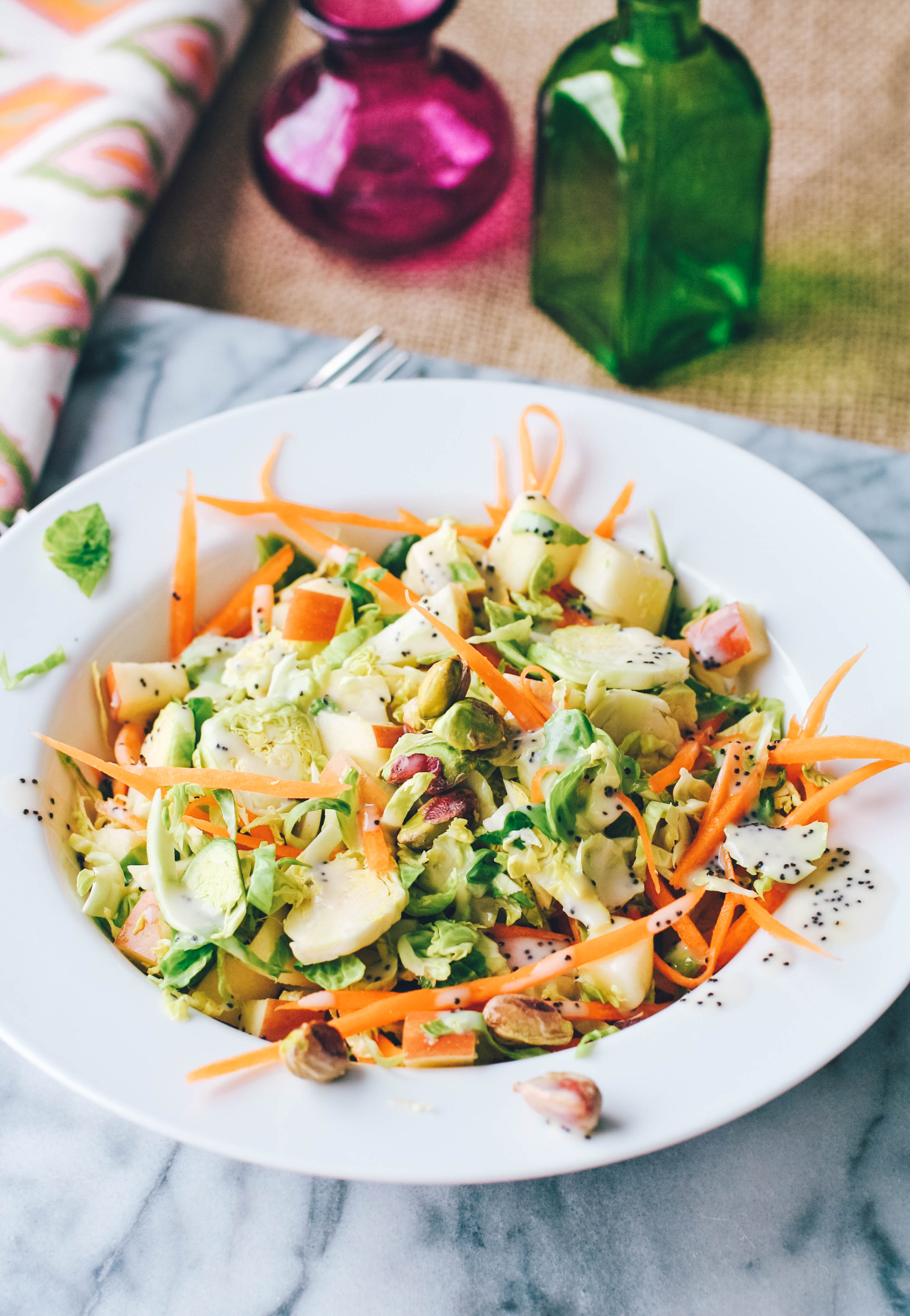 Brussels Sprouts Salad with Carrots, Apples, Pistachios & Poppy Seed Dressing is a hearty, winter salad. You'll enjoy this Brussels Sprouts Salad with Carrots, Apples, Pistachios & Poppy Seed Dressing.
