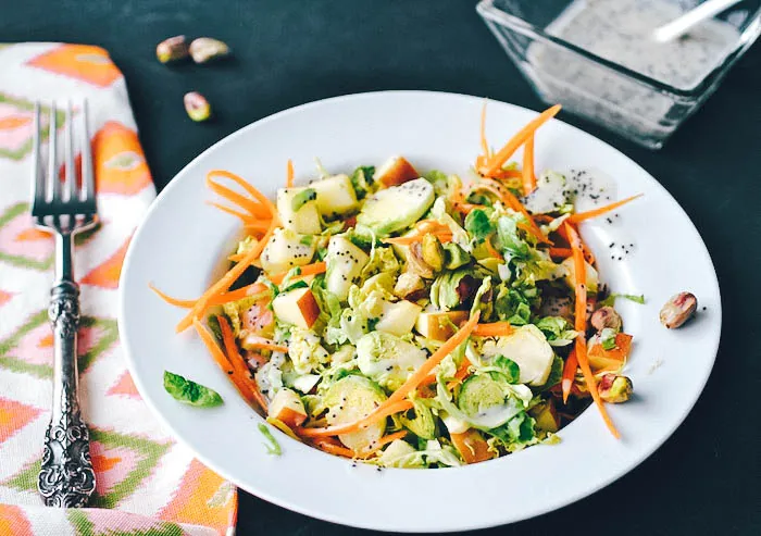 Brussels Sprouts Salad with Carrots, Apples, Pistachios & Poppy Seed Dressing is crunchy and delicious! Brussels Sprouts Salad with Carrots, Apples, Pistachios & Poppy Seed Dressing is a great salad for the winter season!