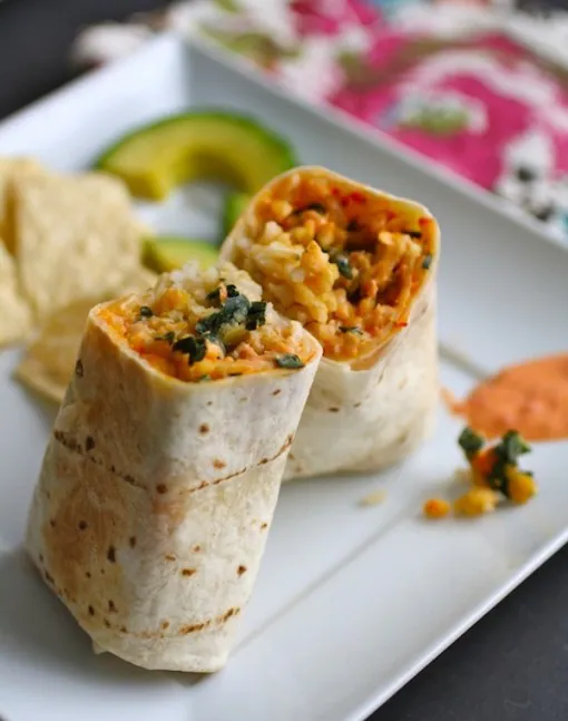 A veggie burrito: Lentil & Kale Burritos with Roasted Red Pepper-Ranch Sauce