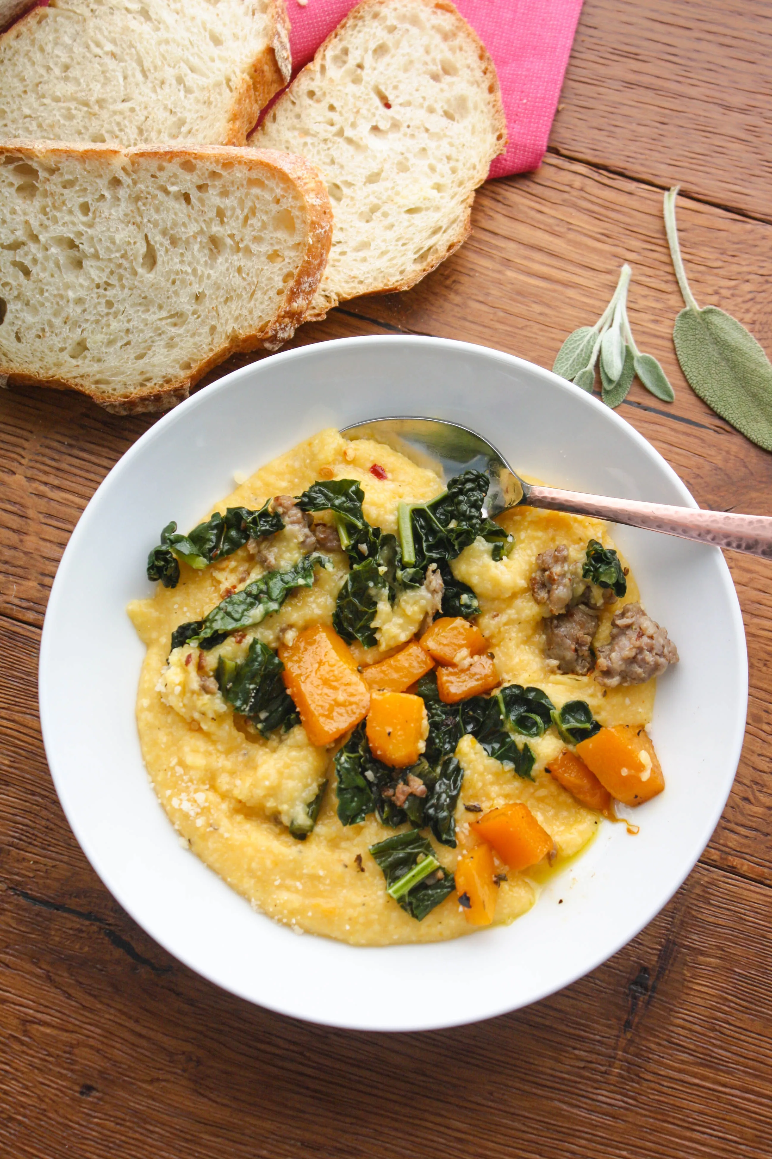 Butternut Squash Grits with Sausage and Kale is a hearty and warming dish to serve when it's cold out. You'll love this hearty and comforting grits dish.