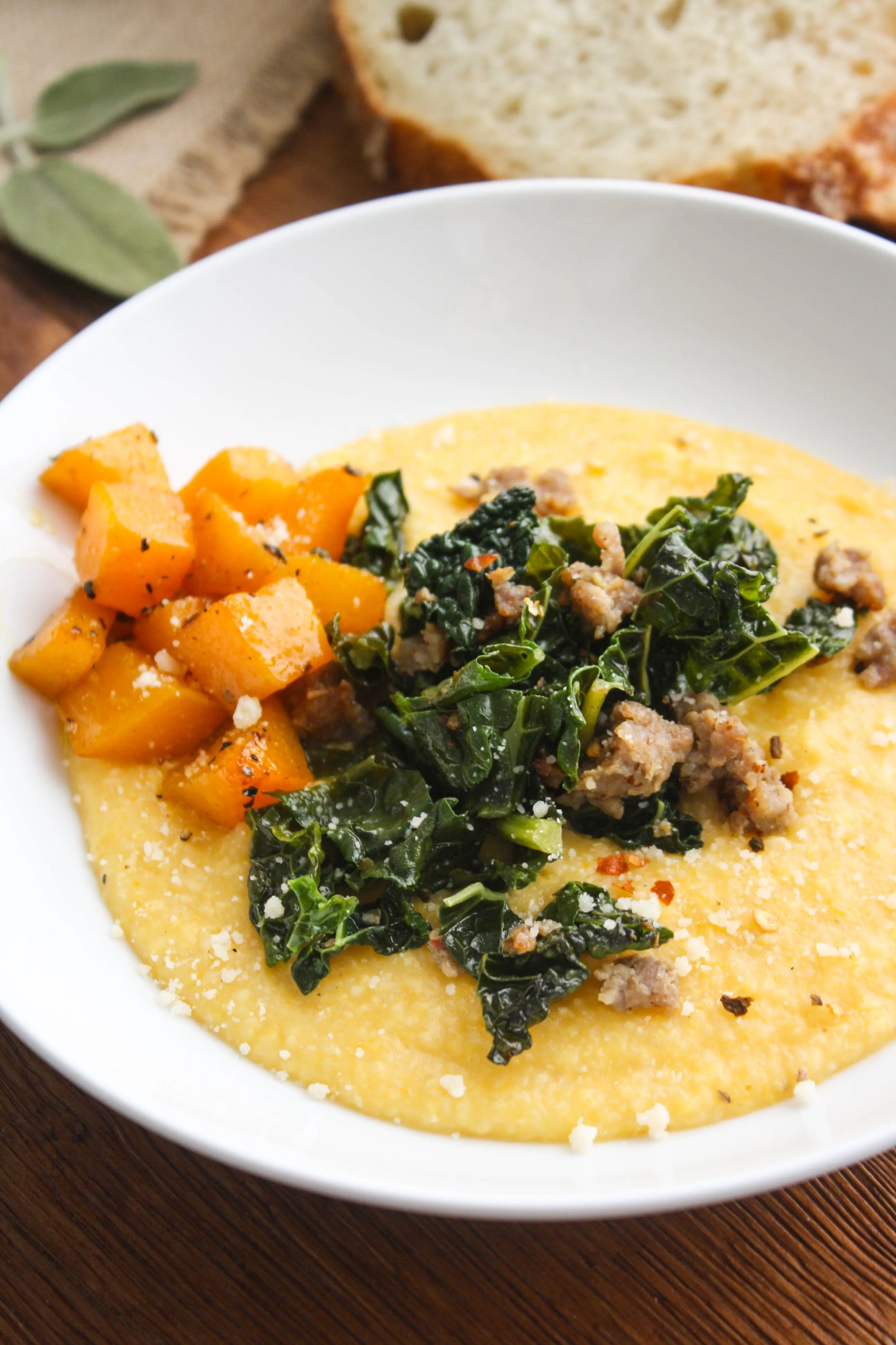 Butternut Squash Grits with Sausage and Kale is a hearty and warming dish. You'll love the flavors in this grits dish!