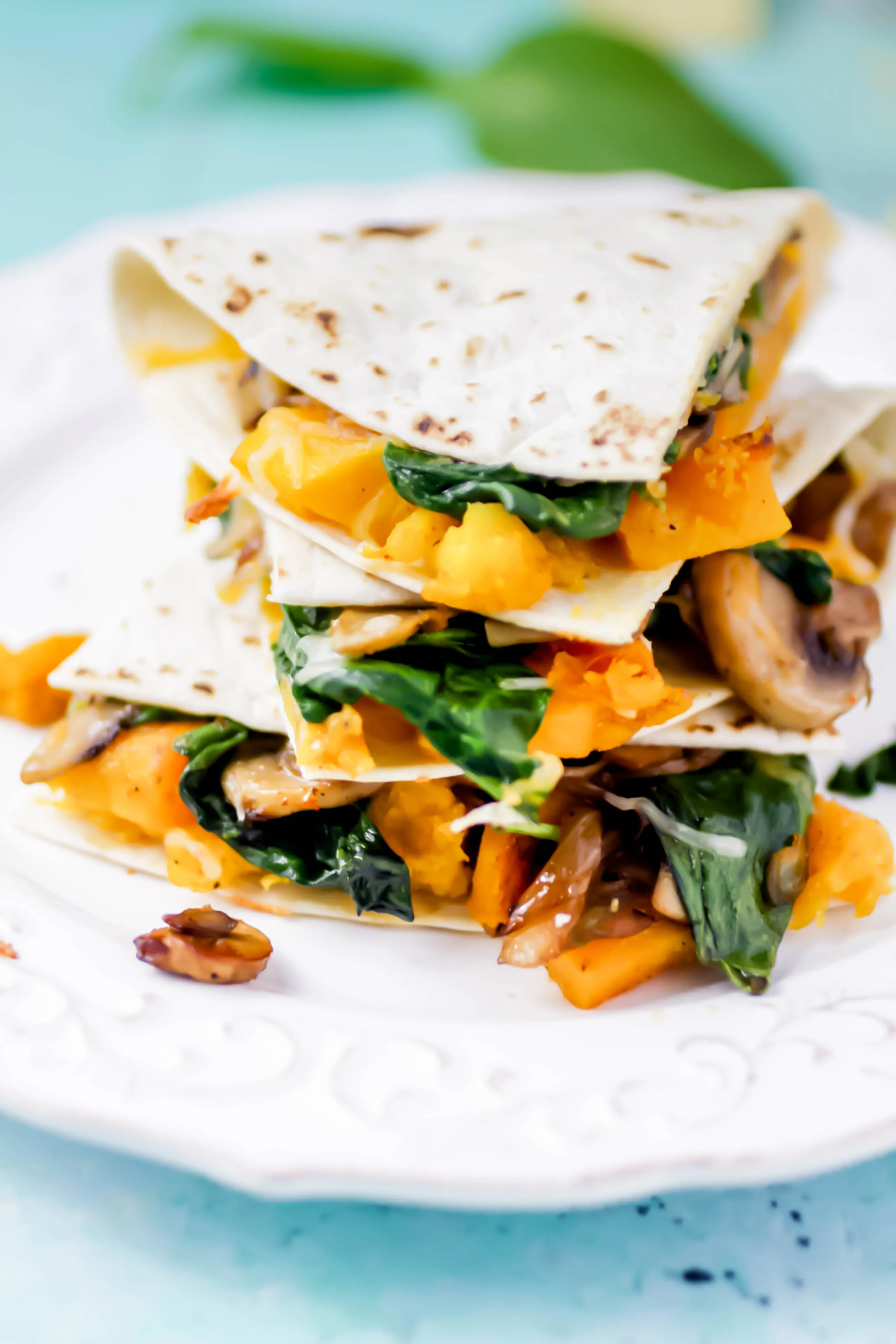 Butternut Squash, Mushroom, Onion, and Spinach Quesadillas stack high for a delightful dish! Butternut Squash, Mushroom, Onion, and Spinach Quesadillas are super-flavorful and easy to make for your next dinner.