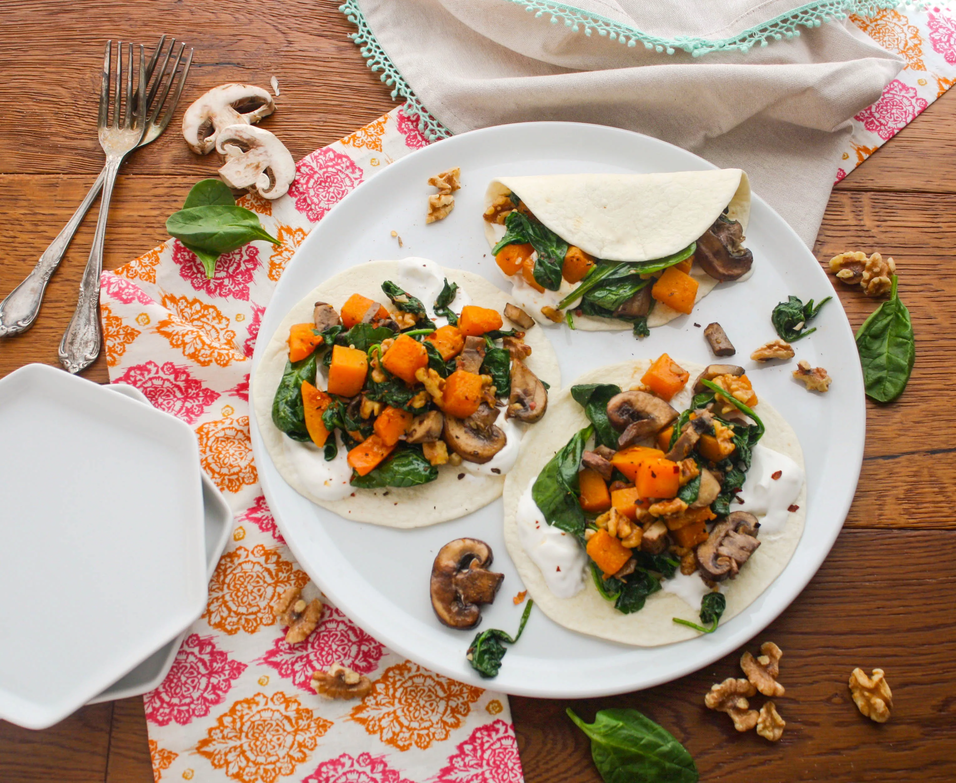 Butternut Squash, Spinach, and Mushroom Tacos are a tasty vegetarian and seasonal meal. You'll love these tacos!