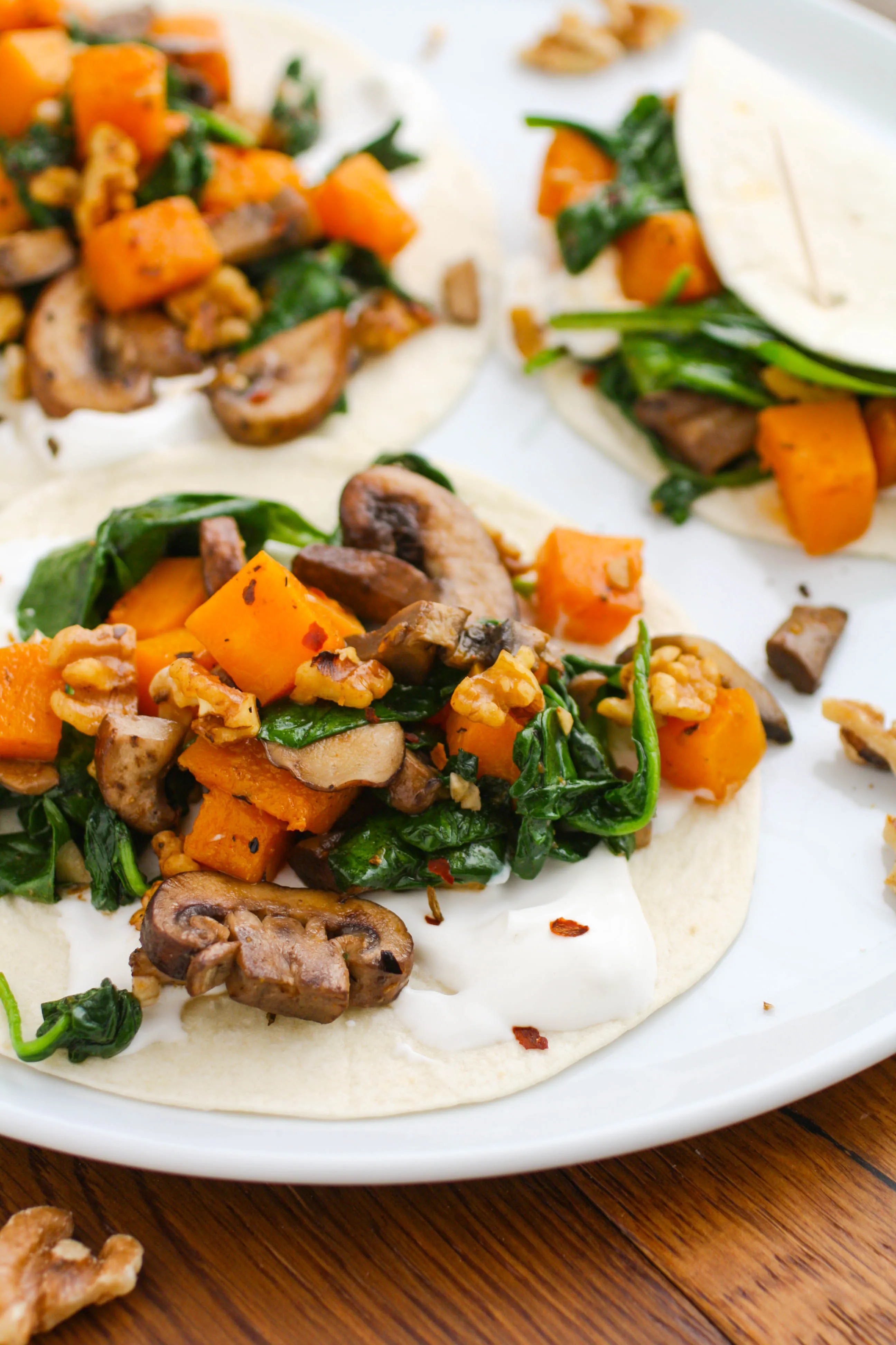 Butternut Squash, Spinach, and Mushroom Tacos make a delightful meatless meal. You'll love how flavorful and tasty these tacos are!