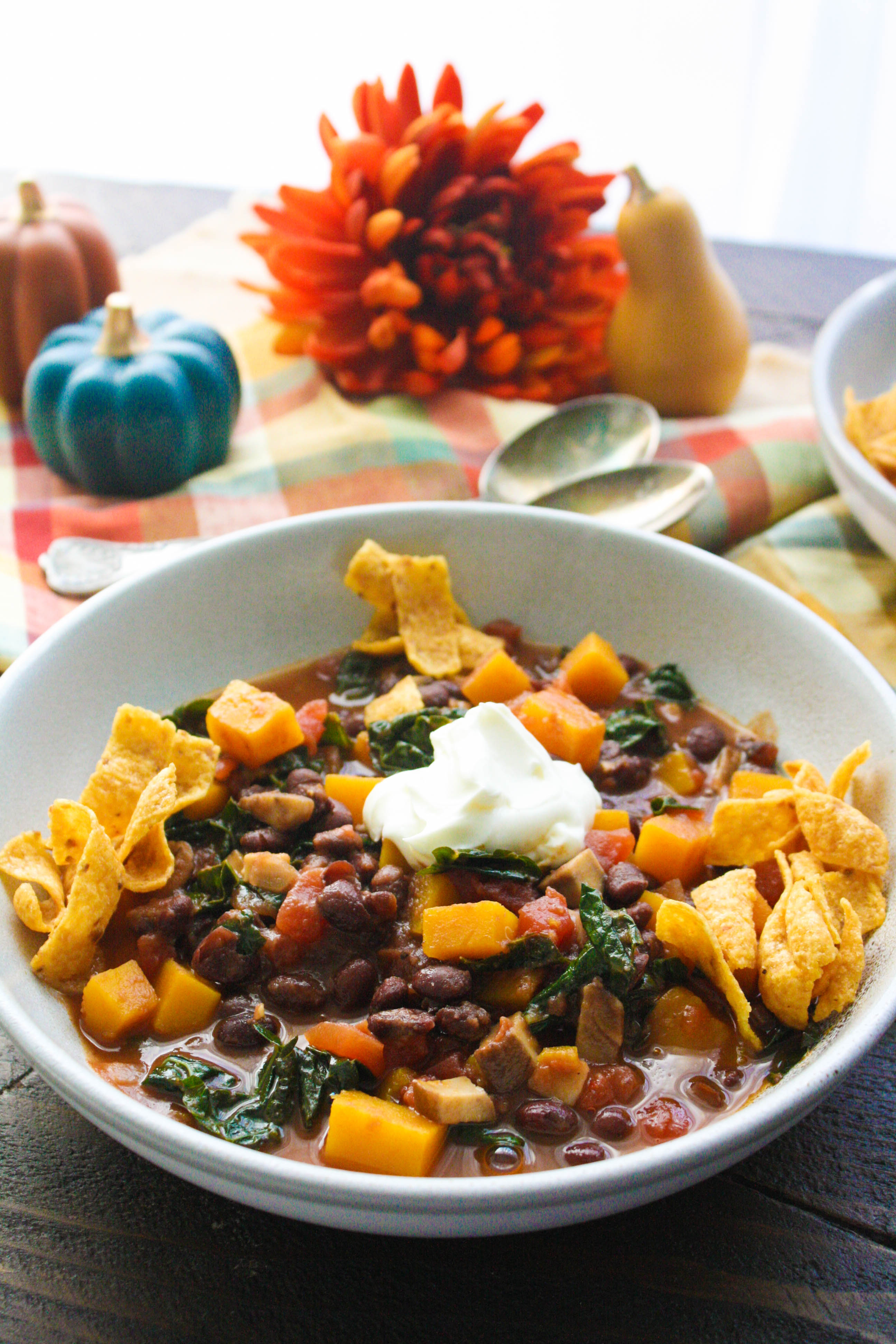 Butternut Squash and Black Bean Chili with Mushrooms & Kale is a fabulous, meatless chili. Butternut Squash and Black Bean Chili with Mushrooms & Kale is easy to make any night of the week.