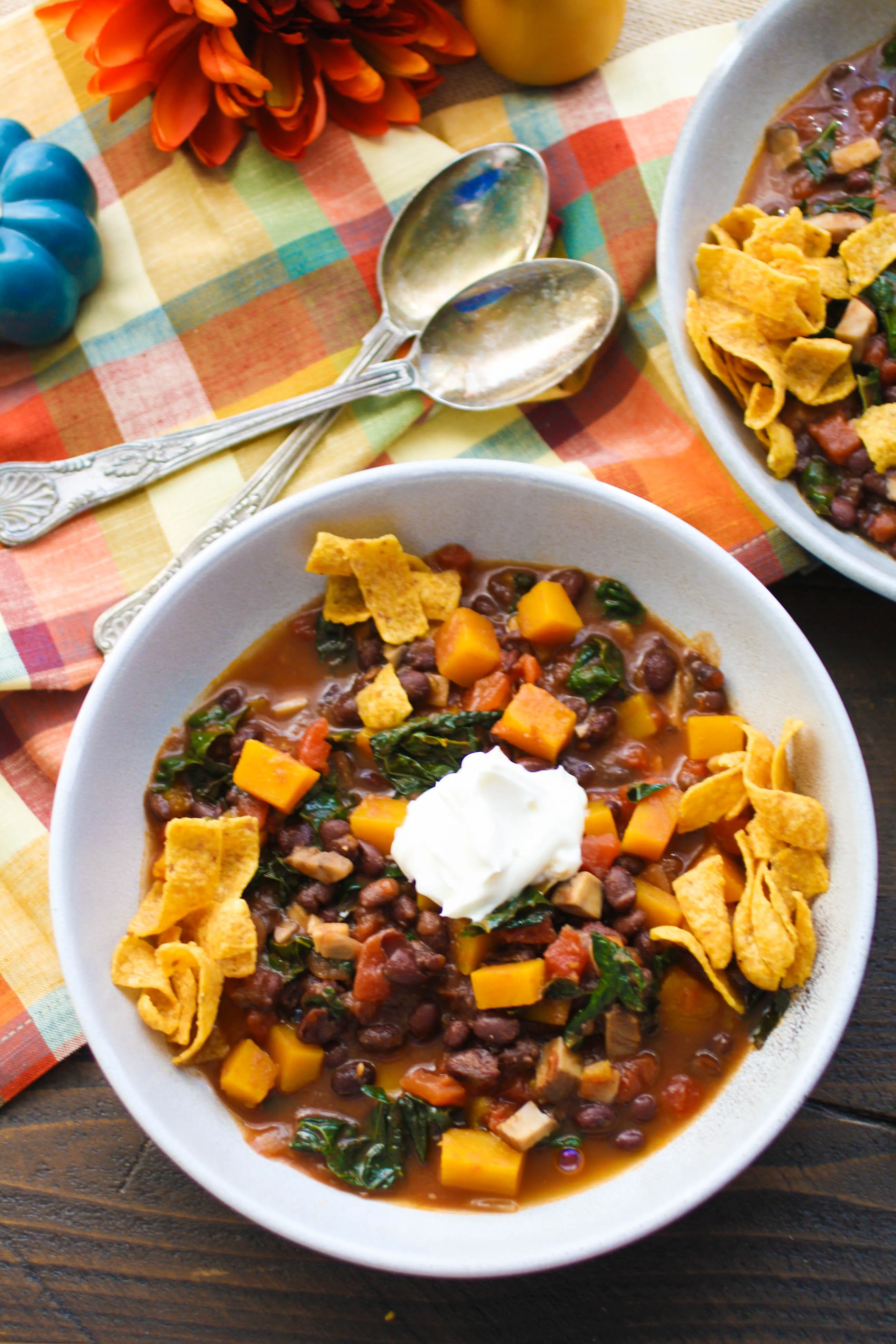 Grab a spoon and dig in to Butternut Squash and Black Bean Chili with Mushrooms & Kale. This recipe for Butternut Squash and Black Bean Chili with Mushrooms & Kale is ideal for Meatless Monday, or any night!