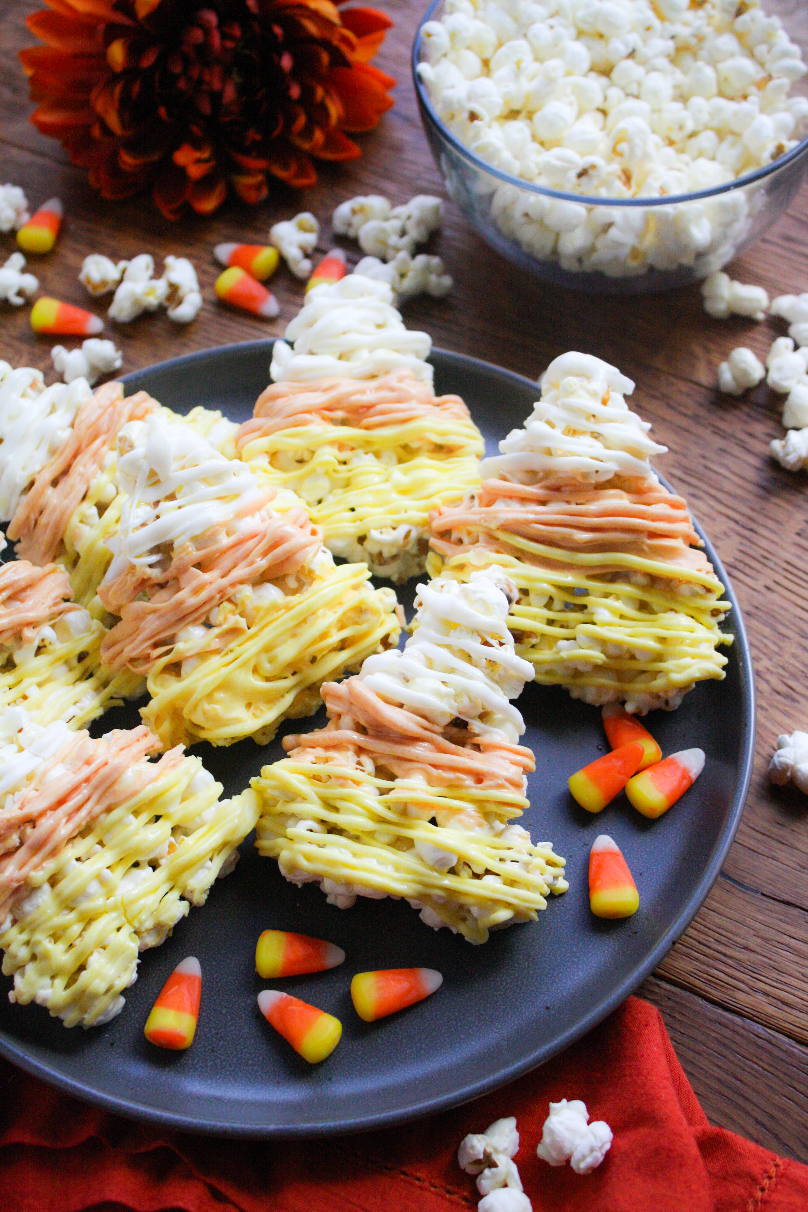 Candy Corn-Shaped Popcorn Balls are a fabulous Halloween treat! You'll love these Candy Corn-Shaped Popcorn Balls for festive fun treats!