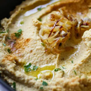 A bowl of caramelized onion hummus is a wonderful snack.
