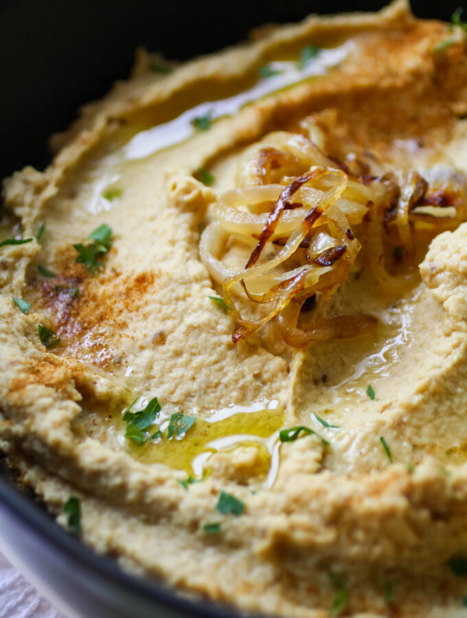 A bowl of caramelized onion hummus is a wonderful snack.