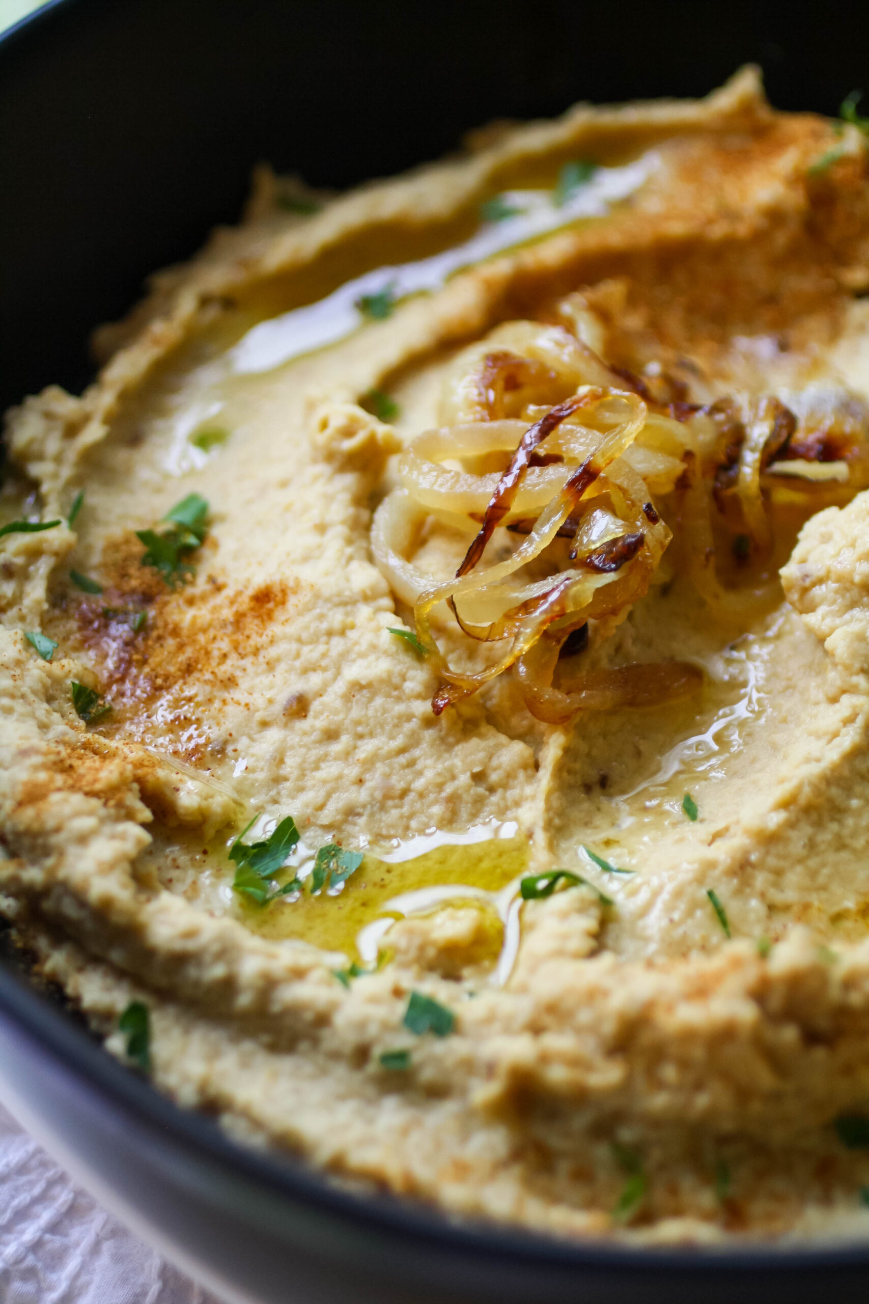 A bowl of caramelized onion hummus is a wonderful snack.