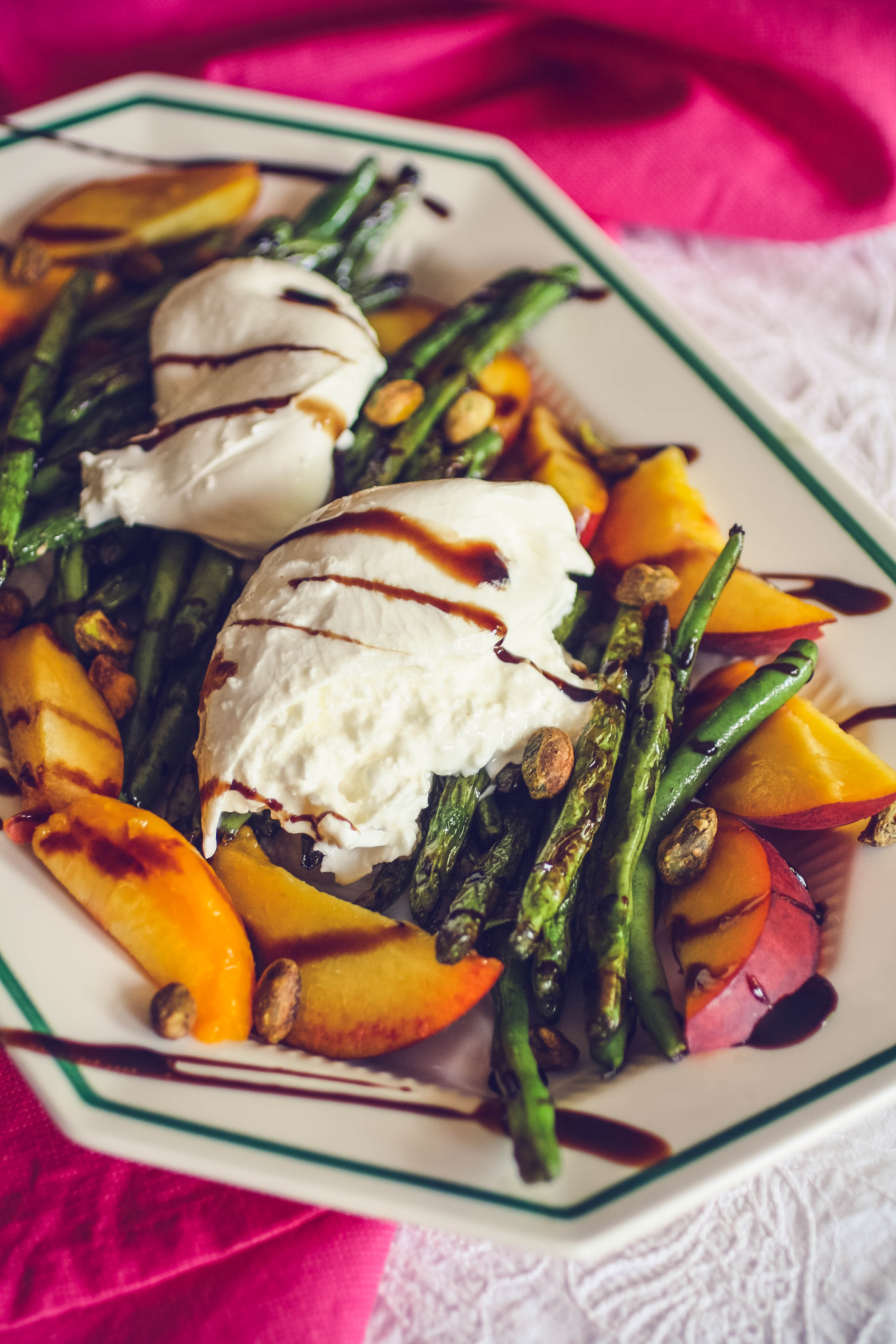 Charred Green Beans with Burrata and Peaches is a fun summer salad. Charred Green Beans with Burrata and Peaches is a delightful salad for the summer season.