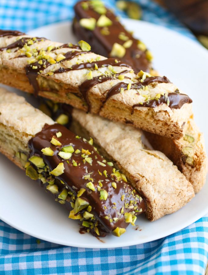Chocolate-Espresso Dipped Orange & Pistachio Biscotti is an Italian-style cookie that is delicious served with coffee or milk! You'll love the flavors!