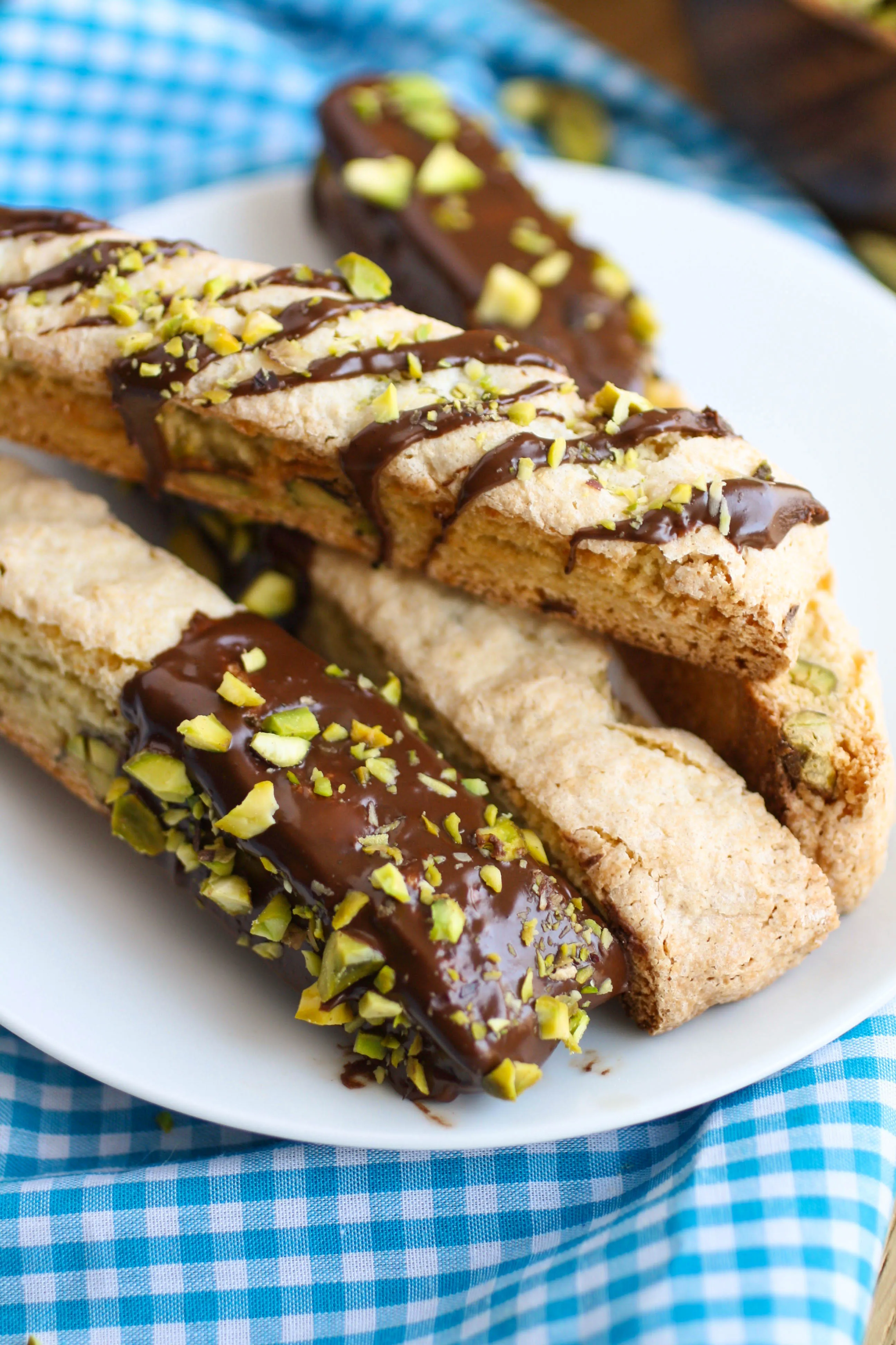 Chocolate-Espresso Dipped Orange and Pistachio Biscotti is an Italian-style cookie that is delicious served with coffee or milk! You'll love the flavors!
