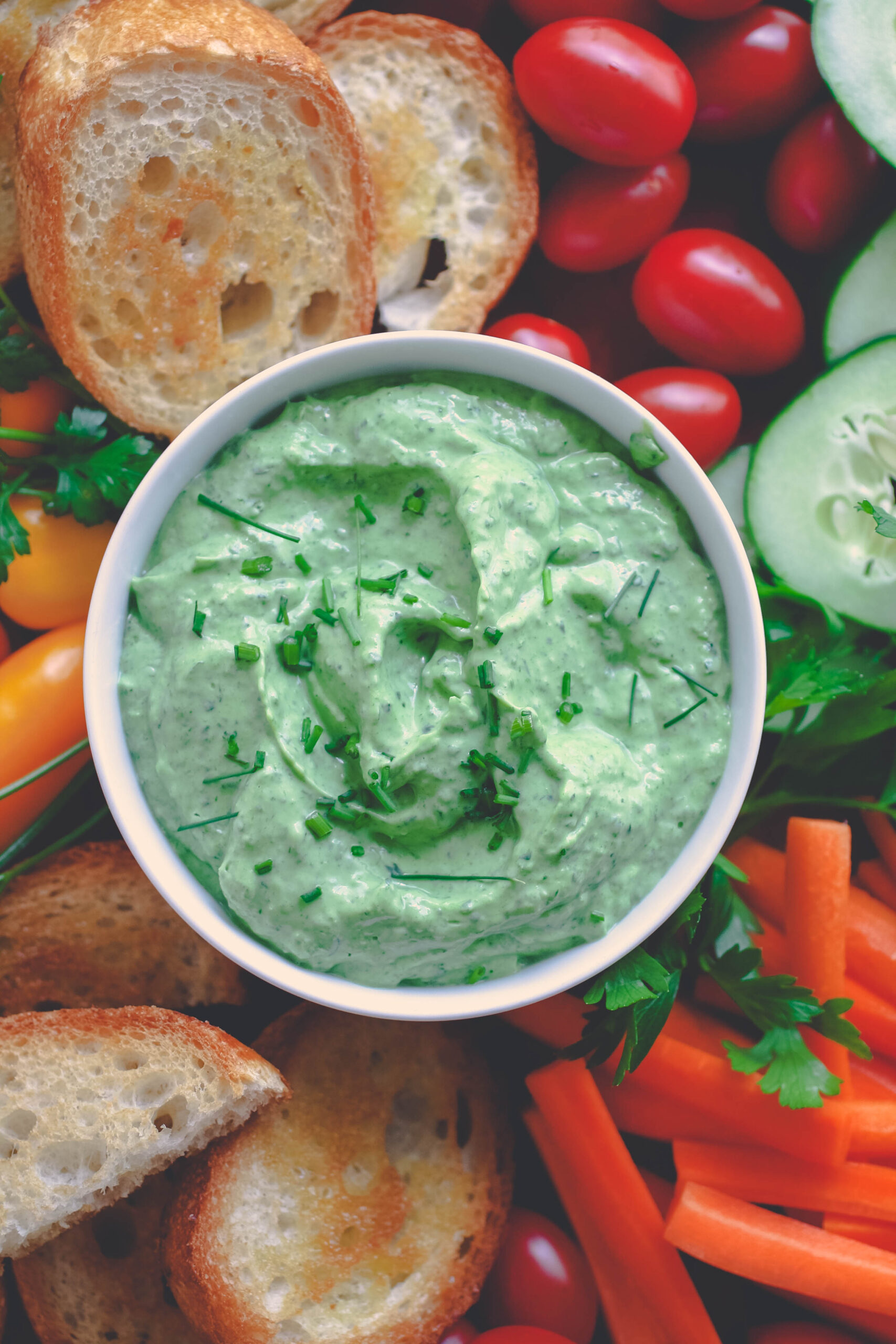 Creamy Green Goddess Dip is perfect in bowl to dig into!