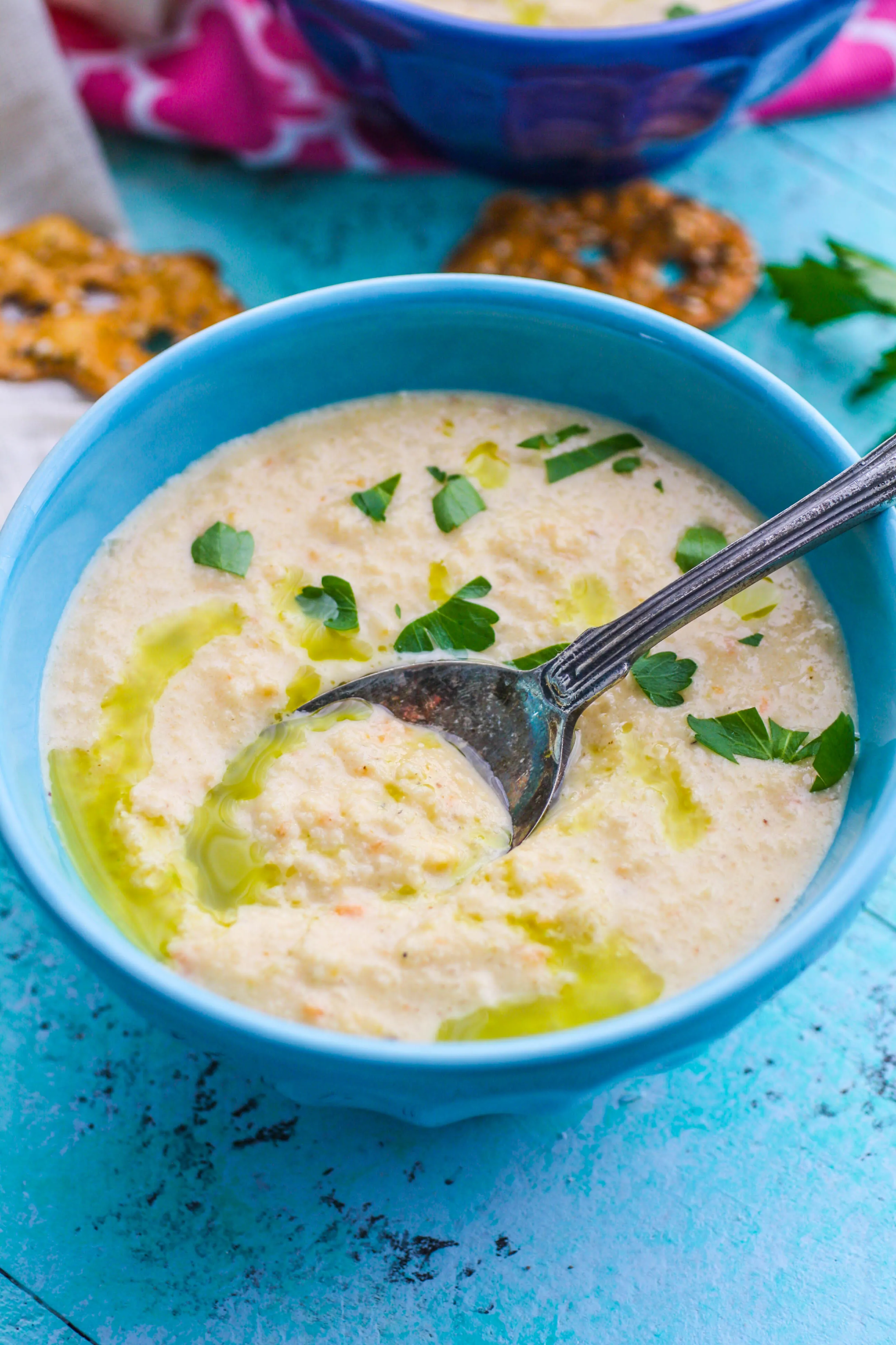 Grab a spoon to dig into this Creamy Roasted Cauliflower Soup with Parsley Oil. You'll love how satisfying Creamy Roasted Cauliflower Soup with Parsley Oil is!