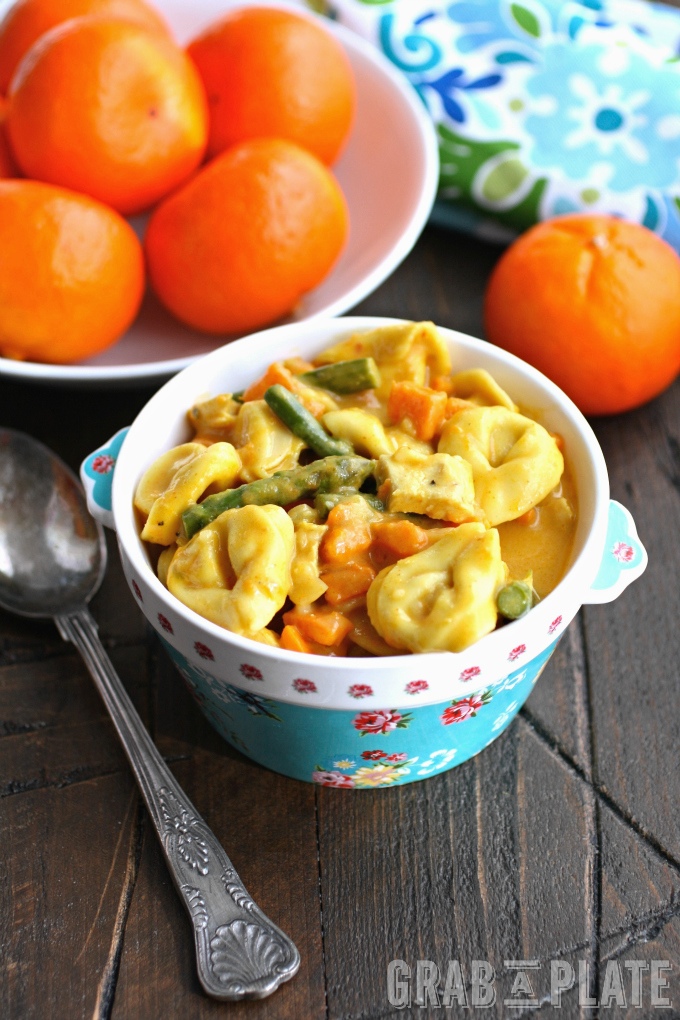 Enjoy a bowl of Creamy Curried Veggie & Chicken Tortellini Soup for a hearty and flavorful meal!