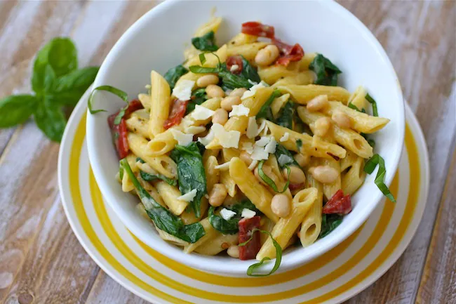 A bowl of Creamy Pasta with White Beans and Spinach