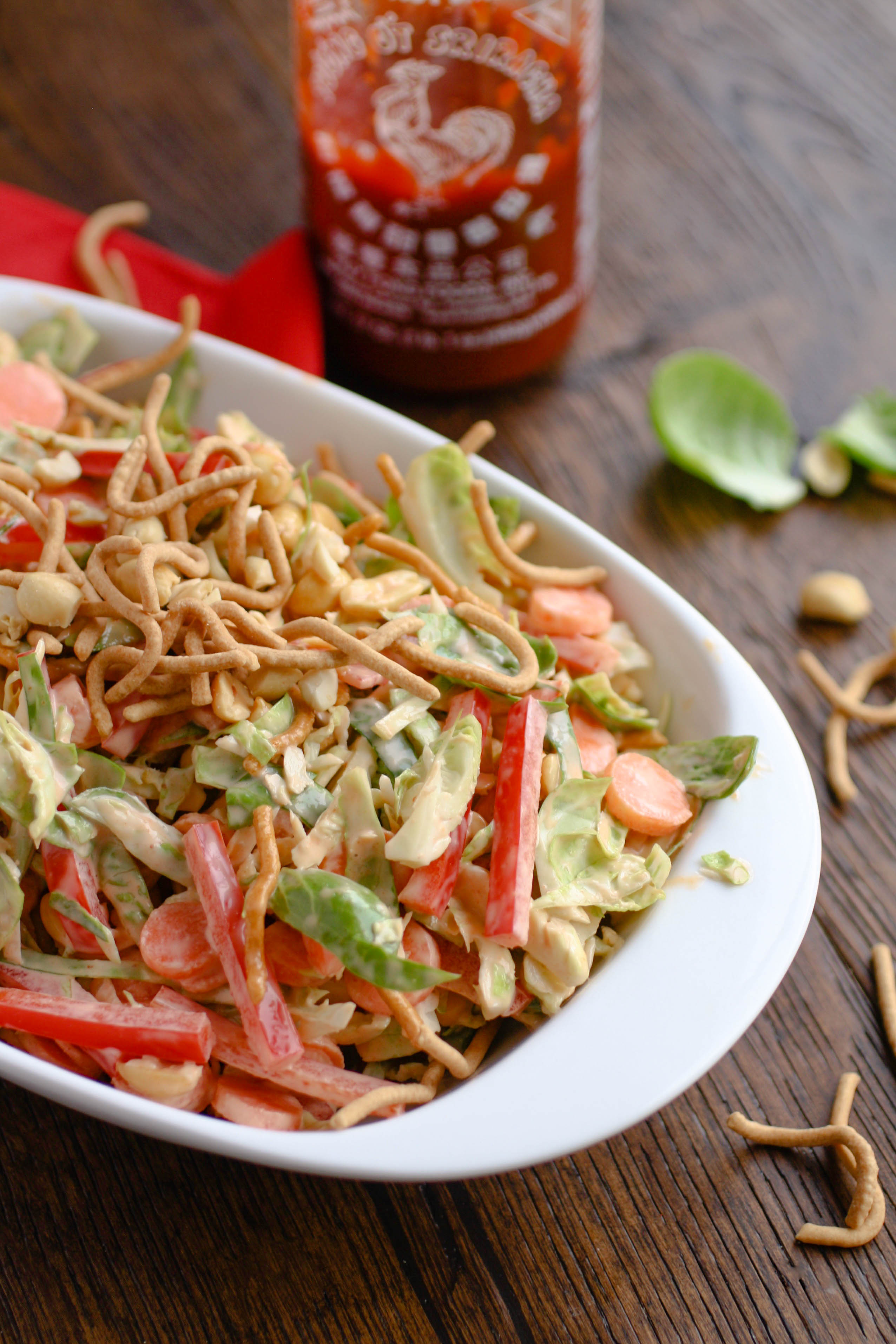 Crunchy Brussels Sprouts Salad with Creamy Sriracha Dressing will be a great salad to serve for Easter. It's easy to make, too!