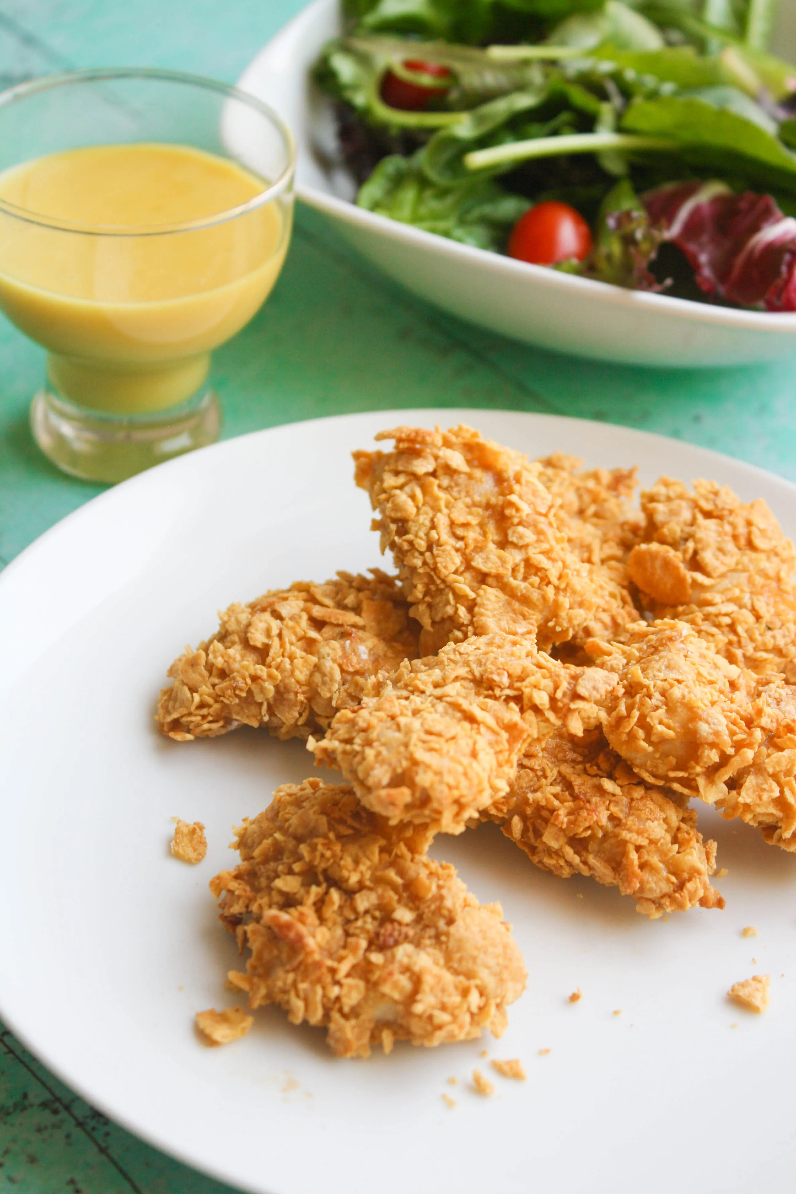 Crunchy Oven Baked Chicken Nuggets with Honey Mustard Sauce are bite-sized fun for dinner! You'll love that this dish is easy to make!