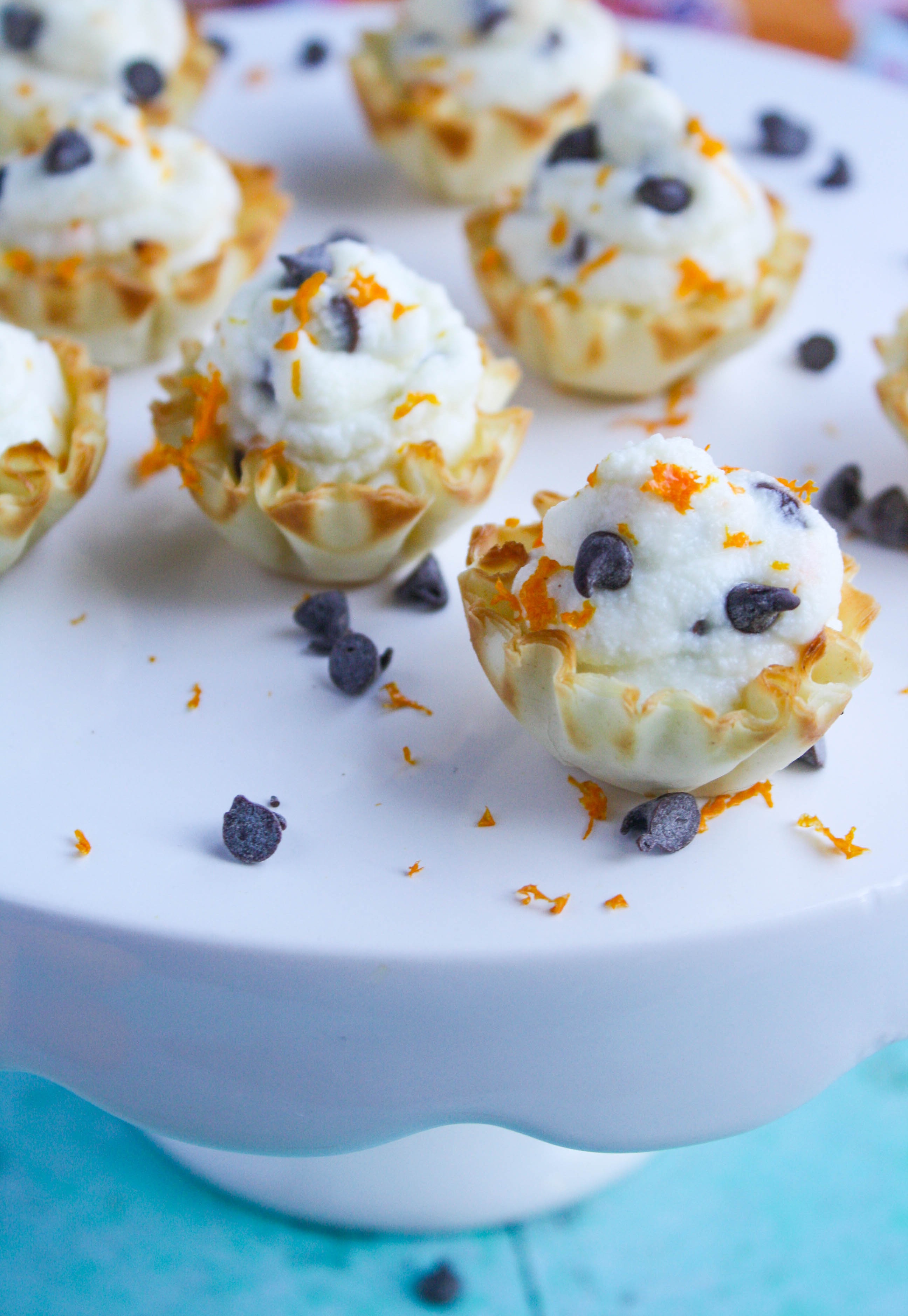 Easy Chocolate Chip-Orange Cannoli Cups are a fun treat for the New Year's celebration, or any fun time. You'll love that these cannoli cups are delicious and so easy to make!