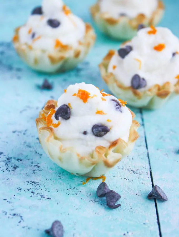 Easy Chocolate Chip-Orange Cannoli Cups are a tasty treat for a special occasion. These cannoli cups are fun and delicious for any party!