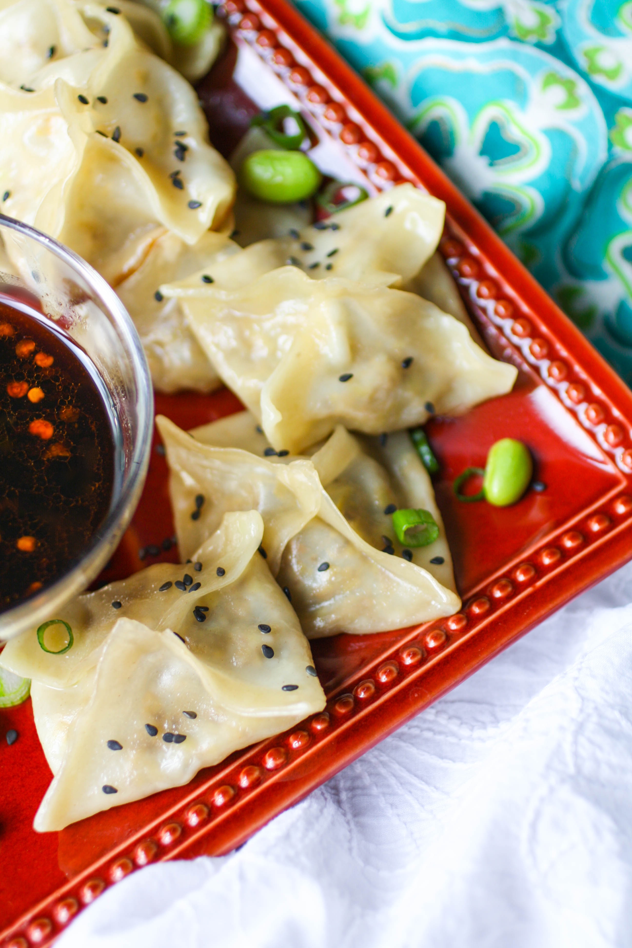 Edamame and Mushroom Potstickers with Dipping Sauce make a fabulous treat for party guests! You don't have to save these potstickers with dipping sauce for parties. Make them any night of the week!