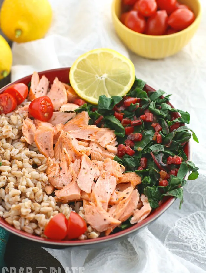 Indulge in a healthy, tasty bowl meal like Warm Farro, Salmon & Swiss Chard Bowls with Lemon Vinaigrette