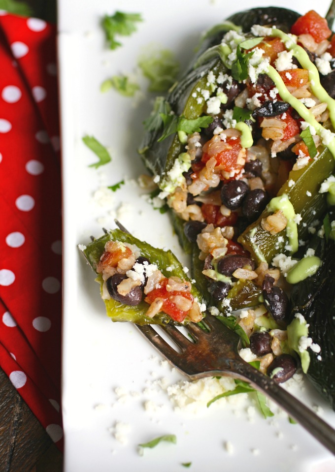 You'll love every bite of Black Bean and Rice Stuffed Poblano Peppers with Avocado Cream!