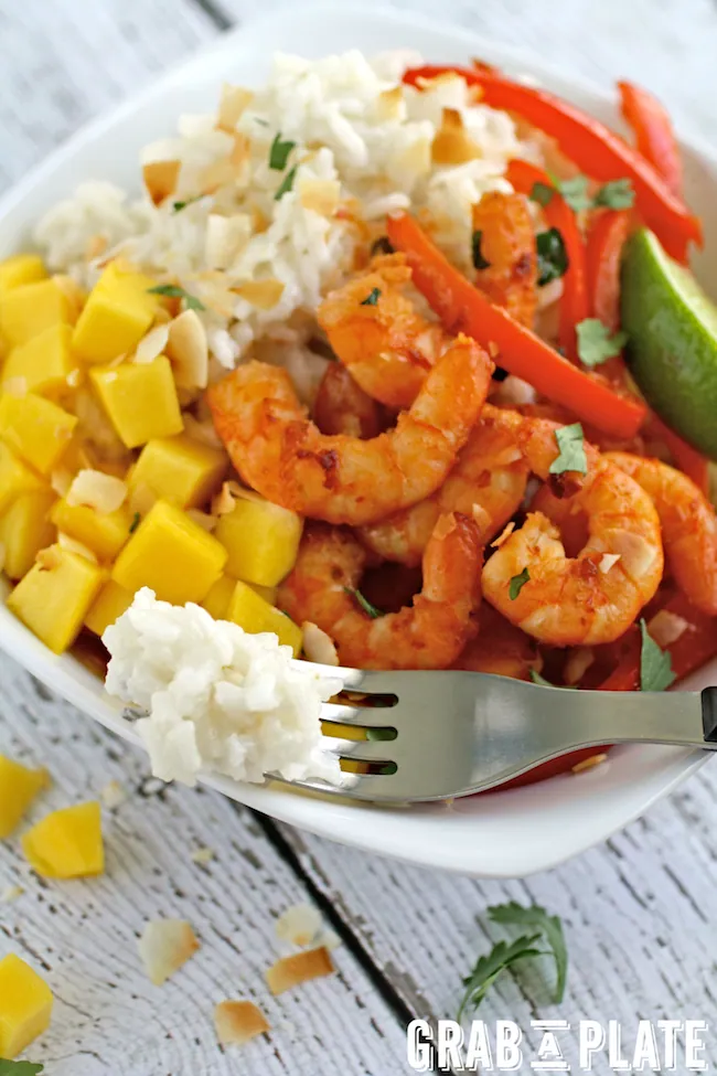 A forkful of dreamy coconut rice from Spicy Citrus Shrimp and Coconut Rice Bowls