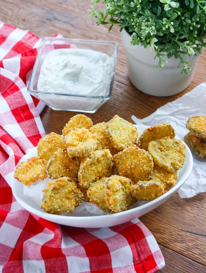 Fried Pickles with Homemade Buttermilk Ranch Dressing are the perfect snack to much on at any gathering. You'll love these pickles as a snack on the weekend!
