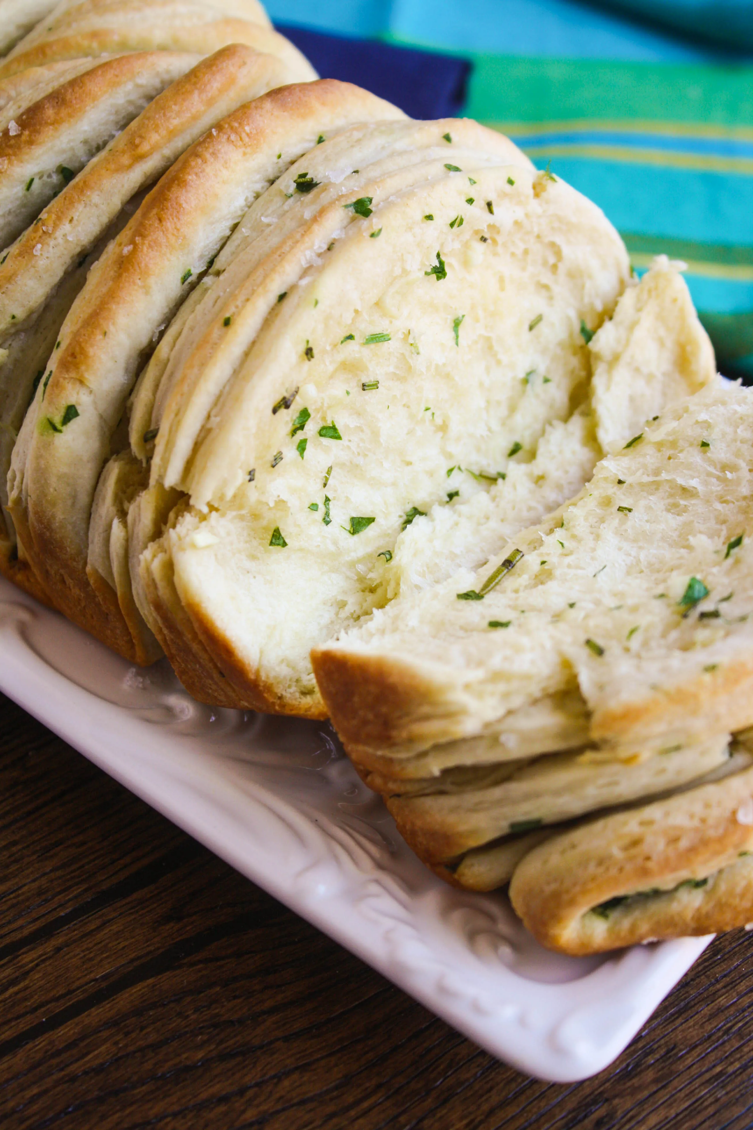Garlic & Herb Pull Apart Bread is fluffy on the inside. You'll love the flavors and how fun it is to serve.